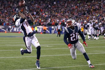 FOXBORO, MA - NOVEMBER 02:  Emmanuel Sanders #10 of the Denver Broncos catches a pass as Malcolm Butler #21 of the New England Patriots defends during the fourth quarter at Gillette Stadium on November 2, 2014 in Foxboro, Massachusetts.  (Photo by Jim Rog