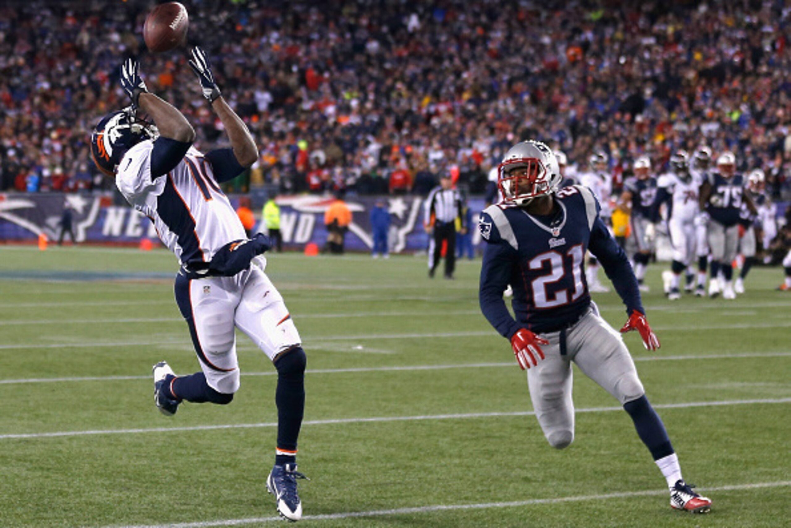 FOXBORO, MA - NOVEMBER 02:  Emmanuel Sanders #10 of the Denver Broncos catches a pass as Malcolm Butler #21 of the New England Patriots defends during the fourth quarter at Gillette Stadium on November 2, 2014 in Foxboro, Massachusetts.  (Photo by Jim Rog