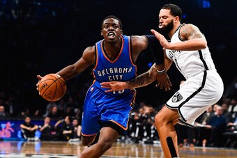 NEW YORK, NY - NOVEMBER 03: Reggie Jackson #15 of the Oklahoma City Thunder attempts to dribble past Deron Williams #8 of the Brooklyn Nets in the first quarter at the Barclays Center on November 3, 2014 in the Brooklyn borough of New York City. NOTE TO U