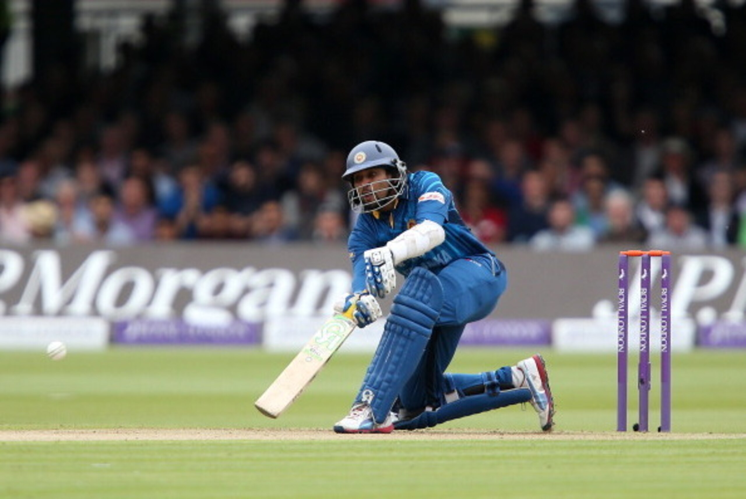 LONDON, ENGLAND - MAY 31:  Tillakaratne Dilshan plays a scoop shot off James Anderson of England during the 4th Royal London One Day International match between England and Sri Lanka at Lord's Cricket Ground on May 31, 2014 in London, England. (Photo by J