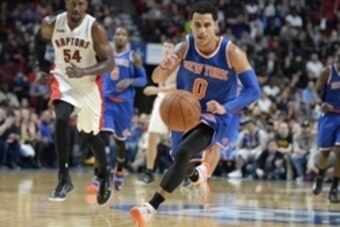 Oct 24, 2014; Montreal, Quebec, CAN; New York Knicks guard Shane Larkin (0) chases the ball during the second half against the Toronto Raptors at the Bell Centre. Mandatory Credit: Eric Bolte-USA TODAY Sports