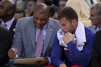 OAKLAND, CA - NOVEMBER 05:  Head coach Doc Rivers of the Los Angeles Clippers talks to Blake Griffin #32 on the bench during their game against the Golden State Warriors at ORACLE Arena on November 5, 2014 in Oakland, California. NOTE TO USER: User expres