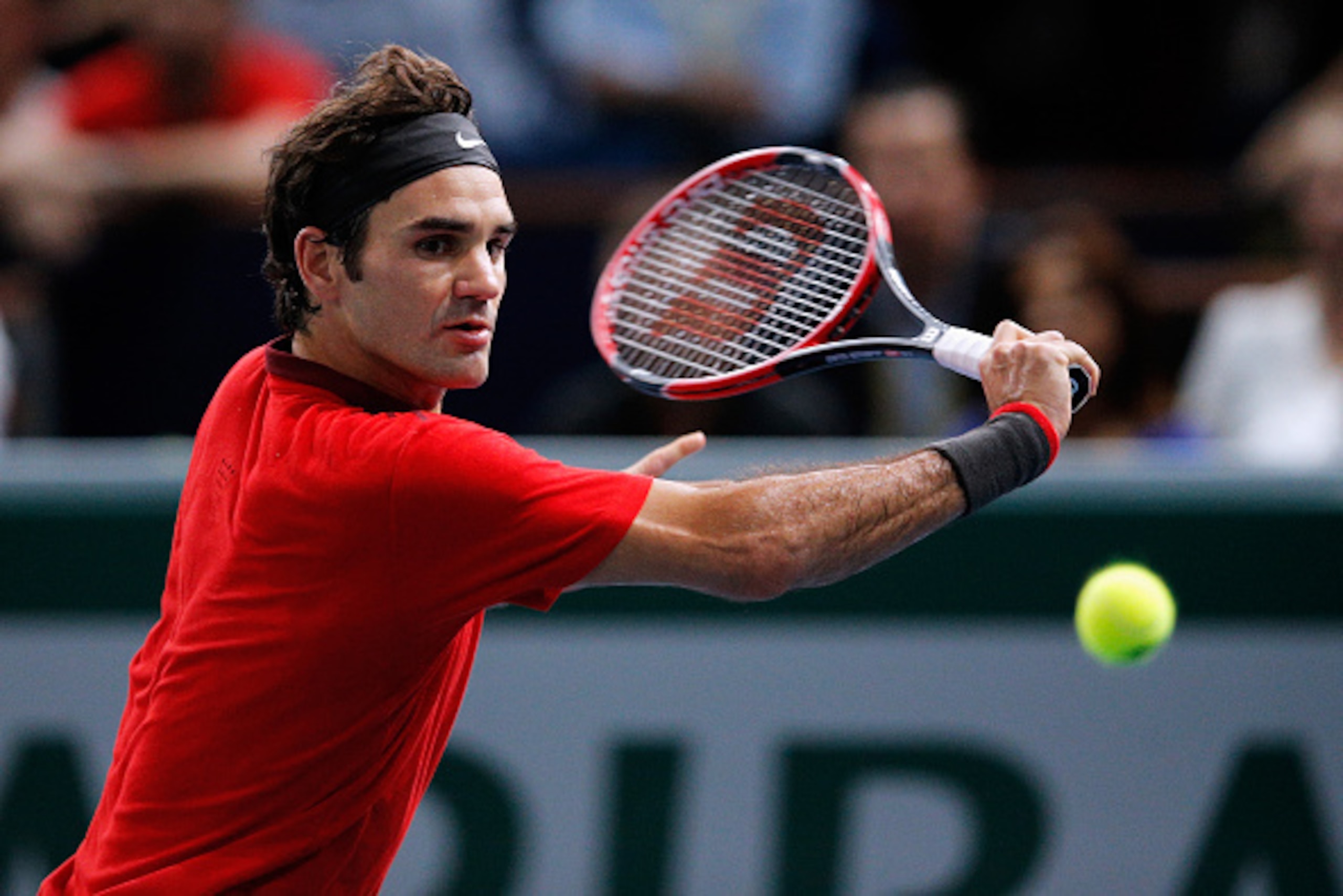 PARIS, FRANCE - OCTOBER 30: Roger Federer of Switzerland in action against Lucas Pouille of France during day 4 of the BNP Paribas Masters held at the at Palais Omnisports de Bercy on October 30, 2014 in Paris, France. (Photo by Dean Mouhtaropoulos/Gett PARIS, FRANCE - OCTOBER 30: Roger Federer of Switzerland in action against Lucas Pouille of France during day 4 of the BNP Paribas Masters held at the at Palais Omnisports de Bercy on October 30, 2014 in Paris, France. (Photo by Dean Mouhtaropoulos/Gett