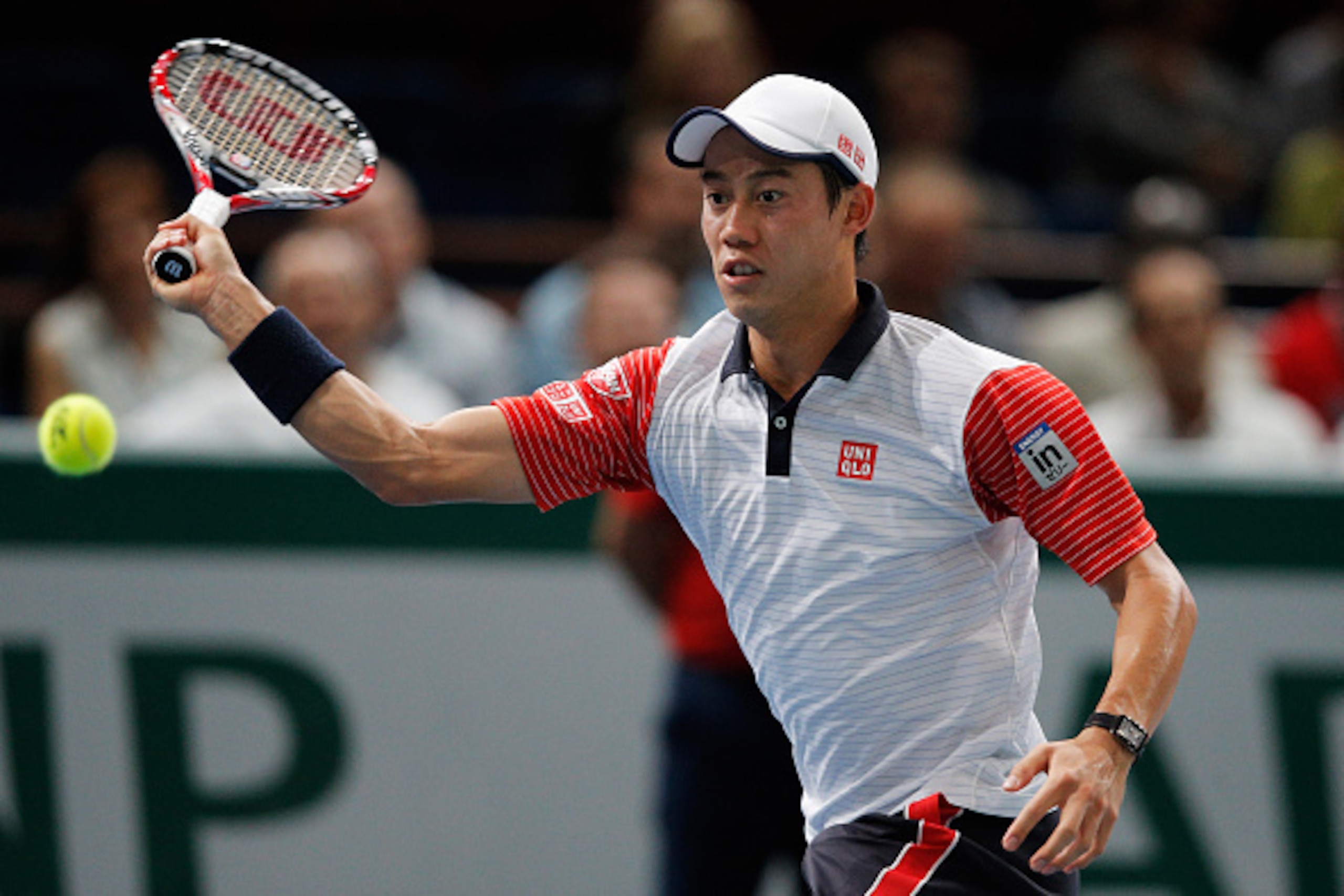 PARIS, FRANCE - NOVEMBER 01: Kei Nishikori of Japan in action against Novak Djokovic of Serbia in their semi final match during day 6 of the BNP Paribas Masters held at the at Palais Omnisports de Bercy on November 1, 2014 in Paris, France. (Photo by De PARIS, FRANCE - NOVEMBER 01: Kei Nishikori of Japan in action against Novak Djokovic of Serbia in their semi final match during day 6 of the BNP Paribas Masters held at the at Palais Omnisports de Bercy on November 1, 2014 in Paris, France. (Photo by De