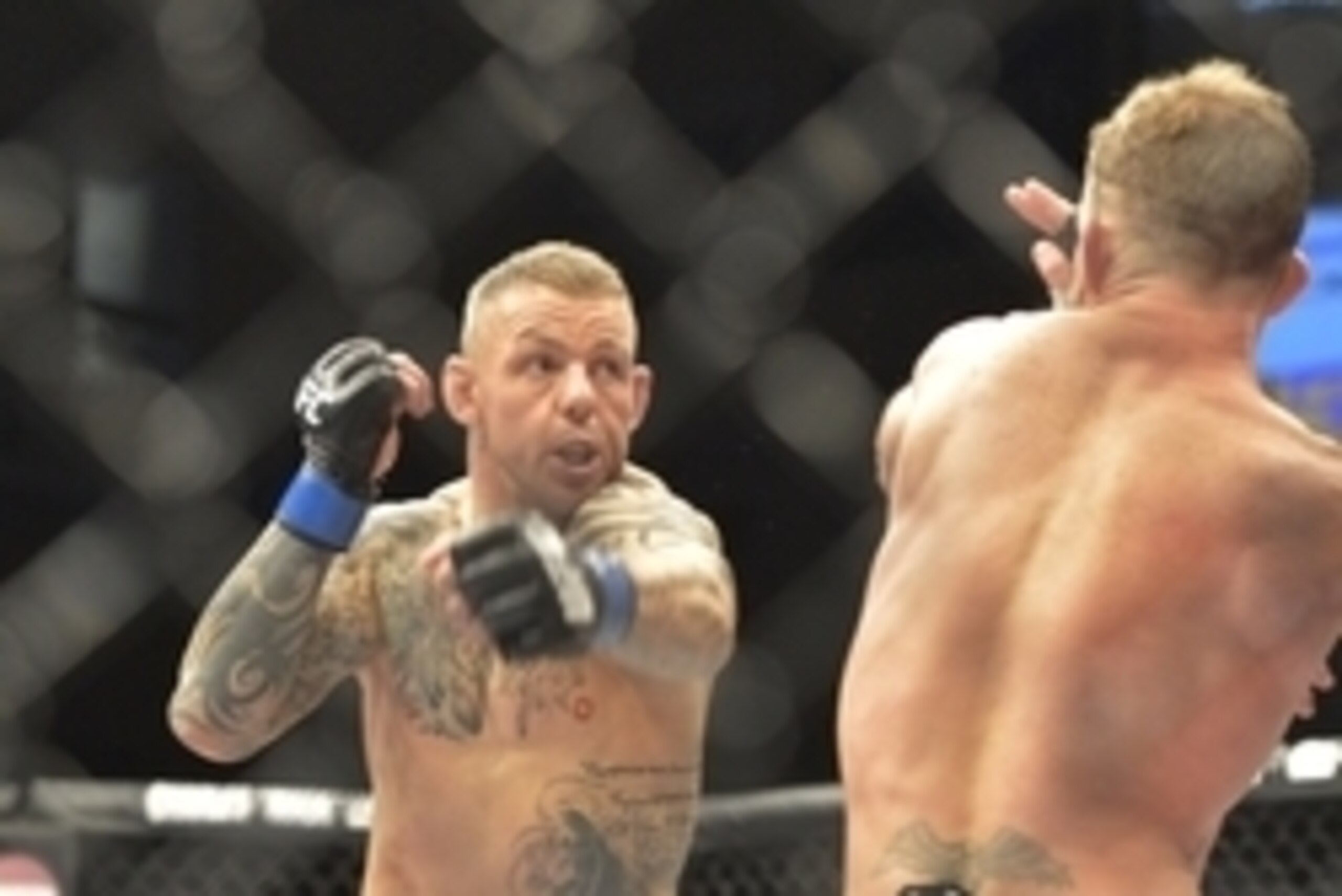 Aug 16, 2014; Bangor, ME, USA; Gray Maynard (red gloves) fights Ross Pearson (blue gloves) during lightweight bout at Cross Insurance Center. Mandatory Credit: Gregory J. Fisher-USA TODAY Sports