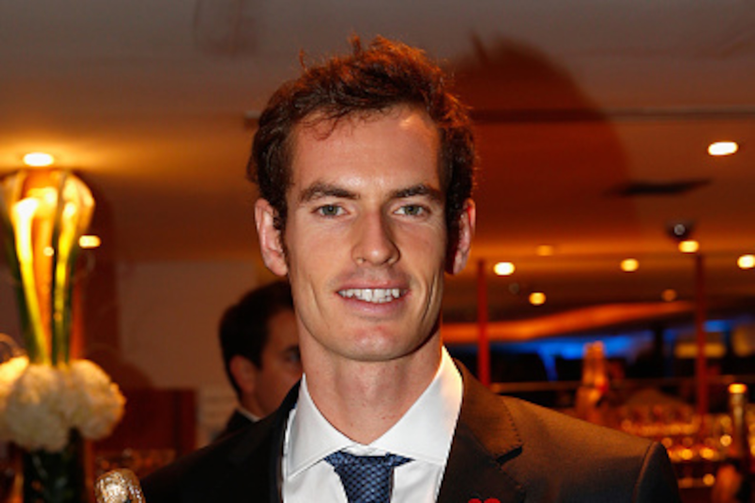 LONDON, ENGLAND - NOVEMBER 07:  Andy Murray of Great Britain poses for a photo after receiving a bottle of Moët & Chandon during the Barclays ATP World Tour Finals tennis previews at the O2 Arena on November 7, 2014 in London, England.  (Photo by Julian F