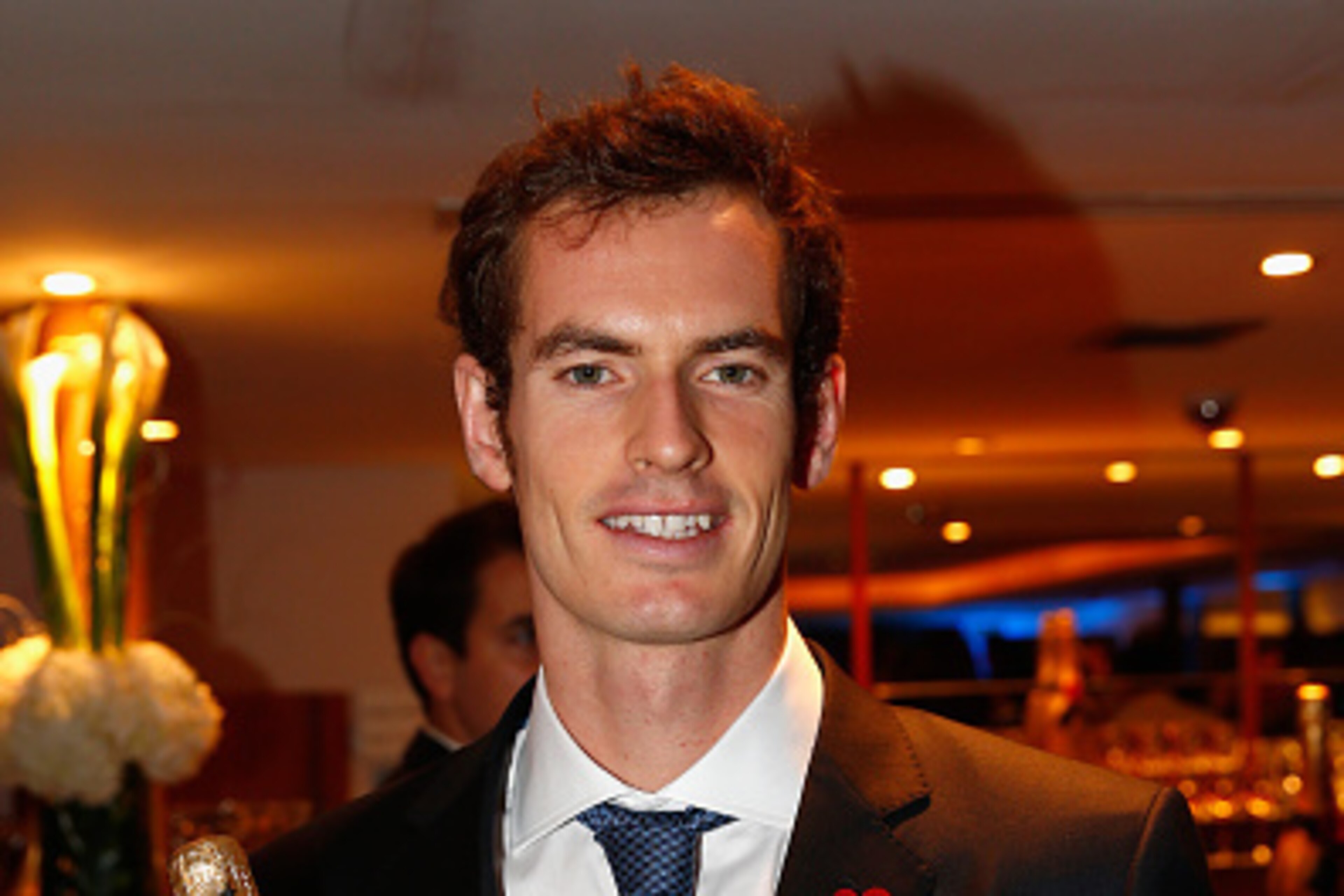 LONDON, ENGLAND - NOVEMBER 07:  Andy Murray of Great Britain poses for a photo after receiving a bottle of Moët & Chandon during the Barclays ATP World Tour Finals tennis previews at the O2 Arena on November 7, 2014 in London, England.  (Photo by Julian F