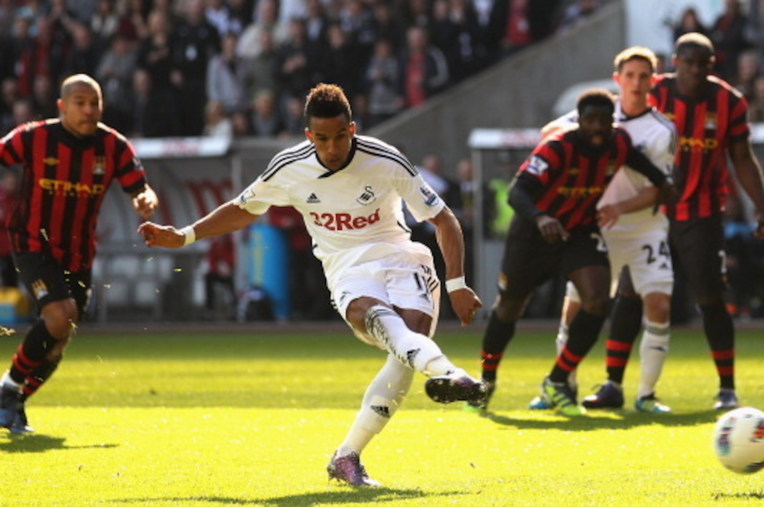 SWANSEA, WALES - MARCH 11:  Scott Sinclair of Swansea City takes a penalty kick which is saved by Joe Hart of Manchester City during the Barclays Premier League match between Swansea City and Manchester City at the Liberty Stadium on March 11, 2012 in Swa