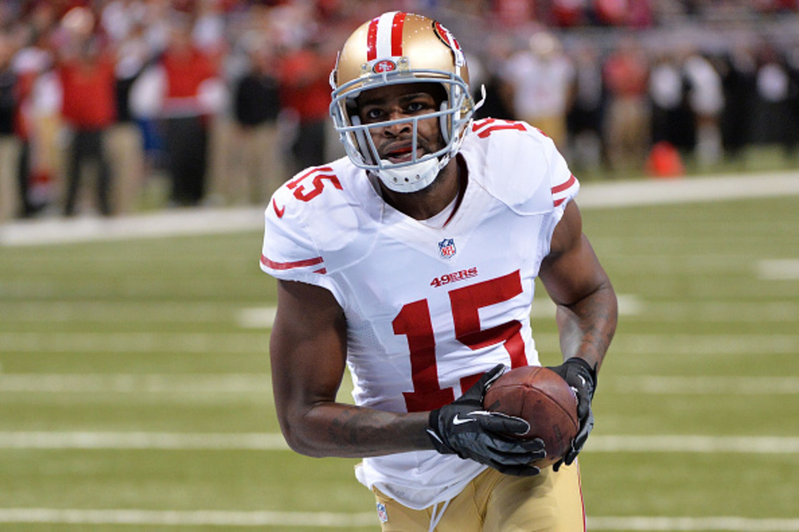 ST LOUIS, MO - OCTOBER 13:  Michael Crabtree #15 of the San Francisco 49ers carries a pass completion into the endzone for a 32 yard touchdown in the third quarter against the St. Louis Rams at Edward Jones Dome on October 13, 2014 in St Louis, Missouri. 