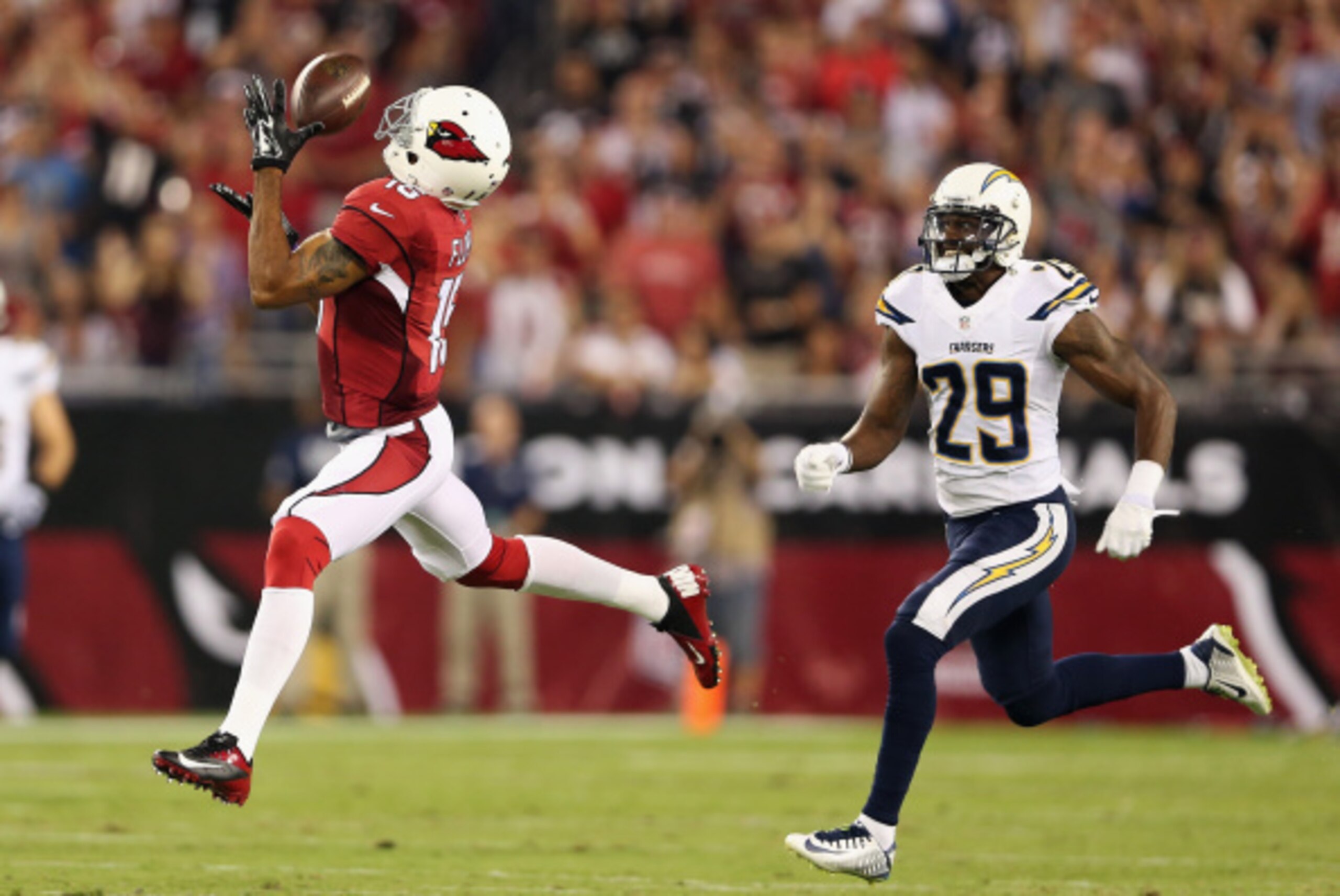 GLENDALE, AZ - SEPTEMBER 08:  Wide receiver Michael Floyd #15 of the Arizona Cardinals makes a 63 yard reception past cornerback Shareece Wright #29 of the San Diego Chargers in the first quarter of the NFL game at the University of Phoenix Stadium on Sep