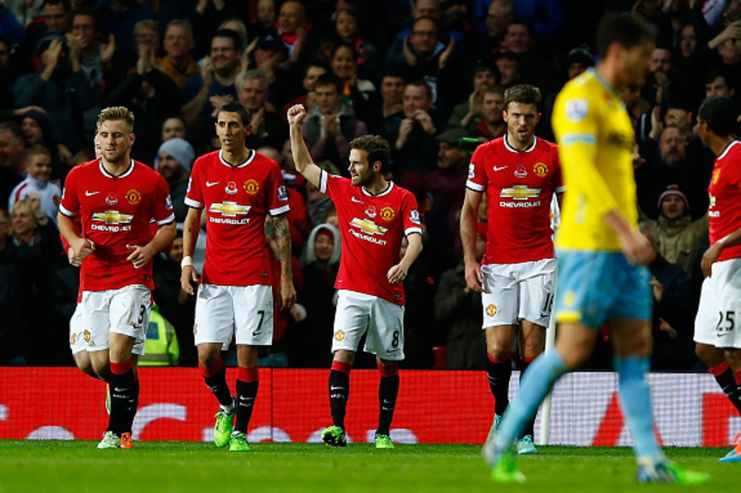 MANCHESTER, ENGLAND - NOVEMBER 08:  Juan Mata of Manchester United celebrates scoring the first goal during the Barclays Premier League match between Manchester United and Crystal Palace at Old Trafford on November 8, 2014 in Manchester, England.  (Photo 