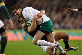 DUBLIN, IRELAND - NOVEMBER 08:   Jonathan Sexton of Ireland is tackled by Jan Serfontein of South Africa during the 2014 Guinness series International match between Ireland and South Africa at Aviva Stadium on November 8, 2014 in Dublin, Ireland. (Photo b