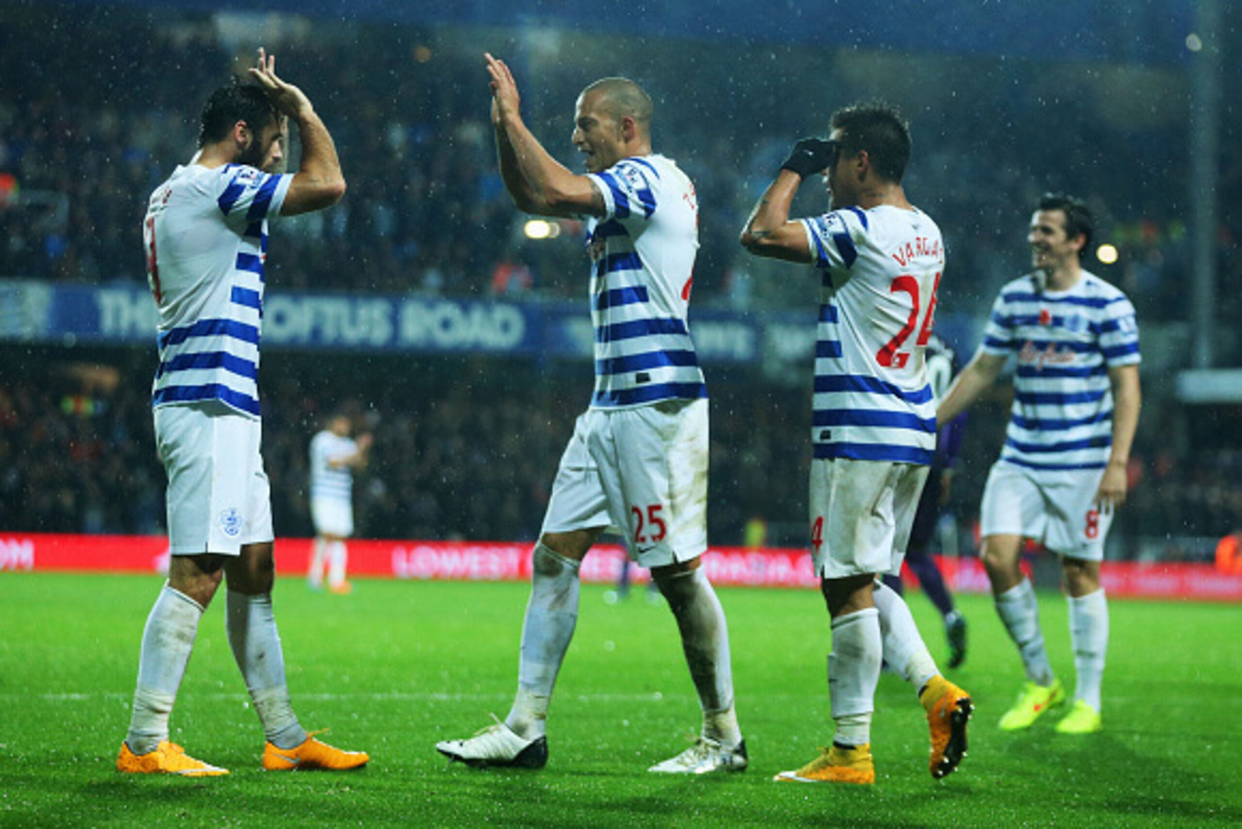 LONDON, ENGLAND - NOVEMBER 08:  (L-R) Charlie Austin, Bobby Zamora, Eduardo Vargas and Joey Barton of QPR celebrate as Martin Demichelis of Manchester City (not pictured) scores an own goal for QPR's second goal during the Barclays Premier League match be