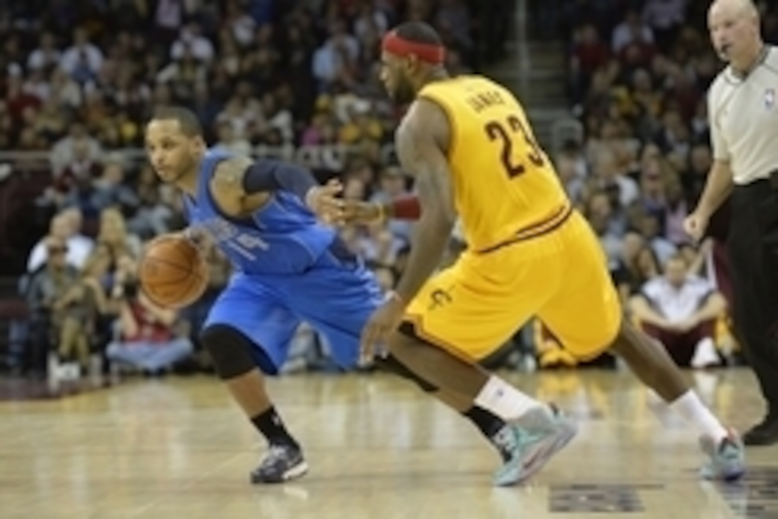 Oct 17, 2014; Cleveland, OH, USA; Dallas Mavericks guard Jameer Nelson (14) drives against Cleveland Cavaliers forward LeBron James (23) in the second quarter at Quicken Loans Arena. Mandatory Credit: David Richard-USA TODAY Sports