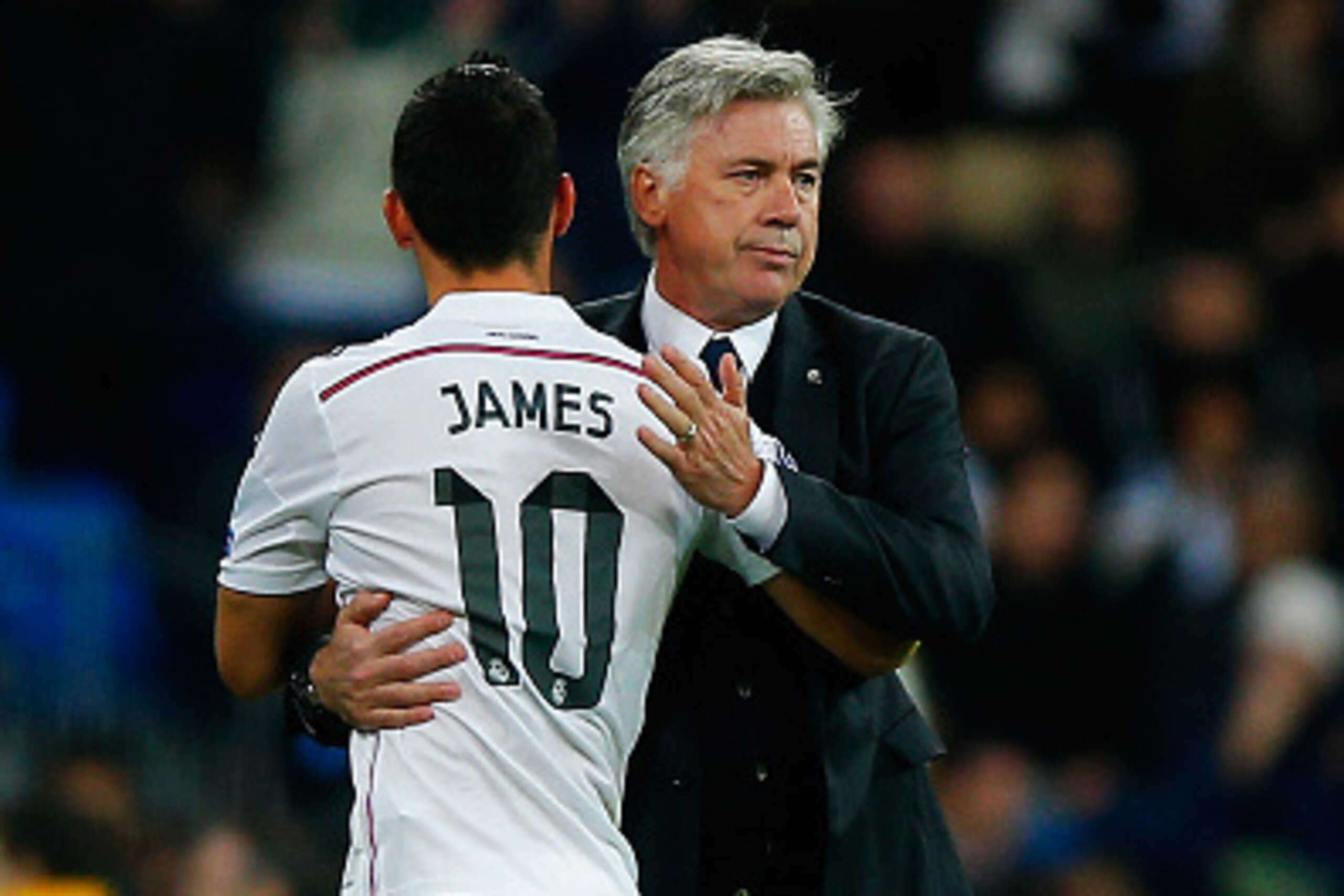 MADRID, SPAIN - NOVEMBER 04: Head coach Carlo Ancelotti of Real Madrid CF embraces his player James Rodriguez after being replaced by Gareth Bale during the UEFA Champions League Group B match between Real Madrid CF and Liverpool FC at Estadio Santiago Be