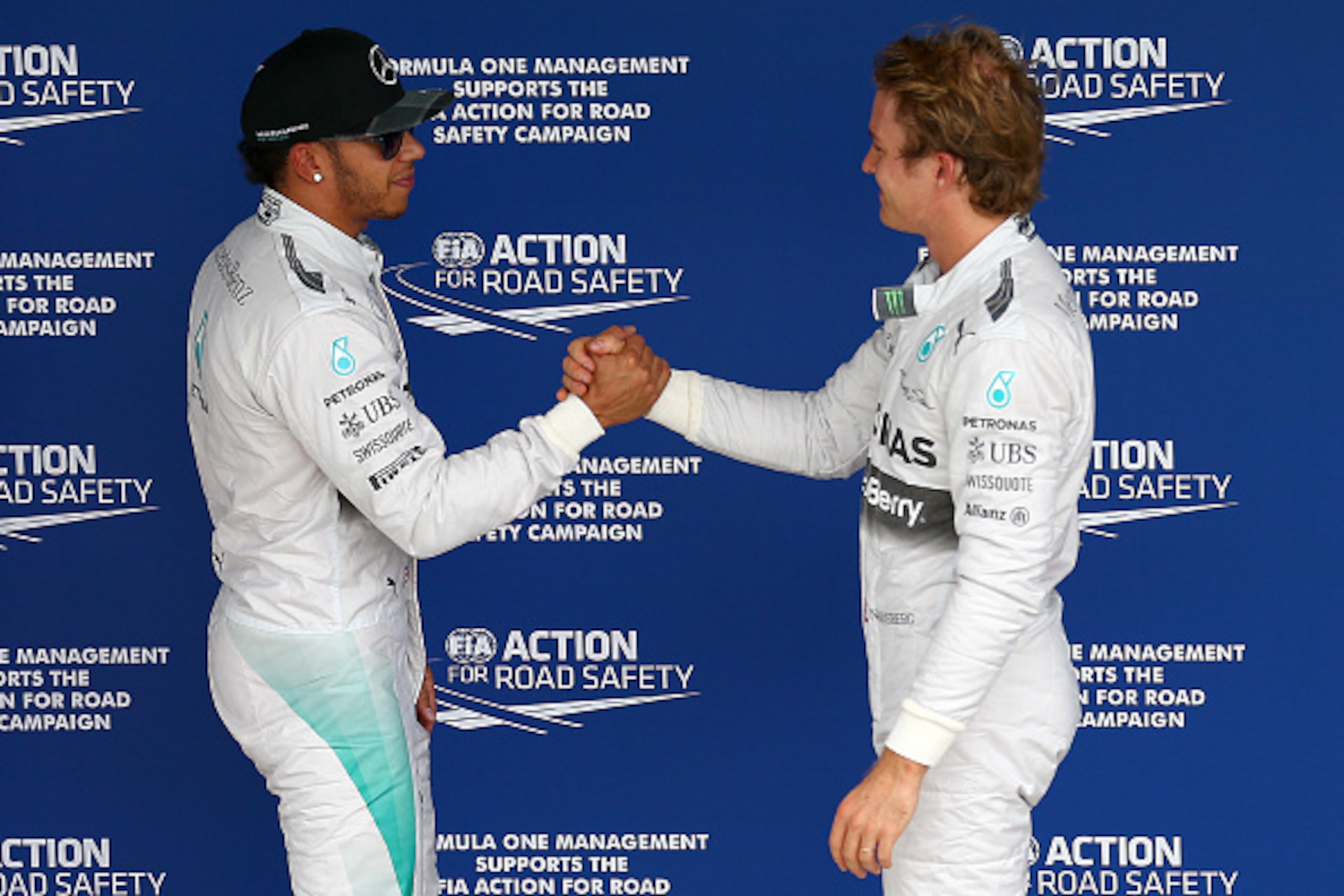 SAO PAULO, BRAZIL - NOVEMBER 08:  Nico Rosberg of Germany and Mercedes GP shakes hands with Lewis Hamilton of Great Britain and Mercedes GP claiming pole position during qualifying for the Brazilian Formula One Grand Prix at Autodromo Jose Carlos Pace on 