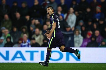 LONDON, ENGLAND - NOVEMBER 08:  Sergio Aguero of Manchester City celebrates as he scores their first and equalising goal during the Barclays Premier League match between Queens Park Rangers and Manchester City at Loftus Road on November 8, 2014 in London,