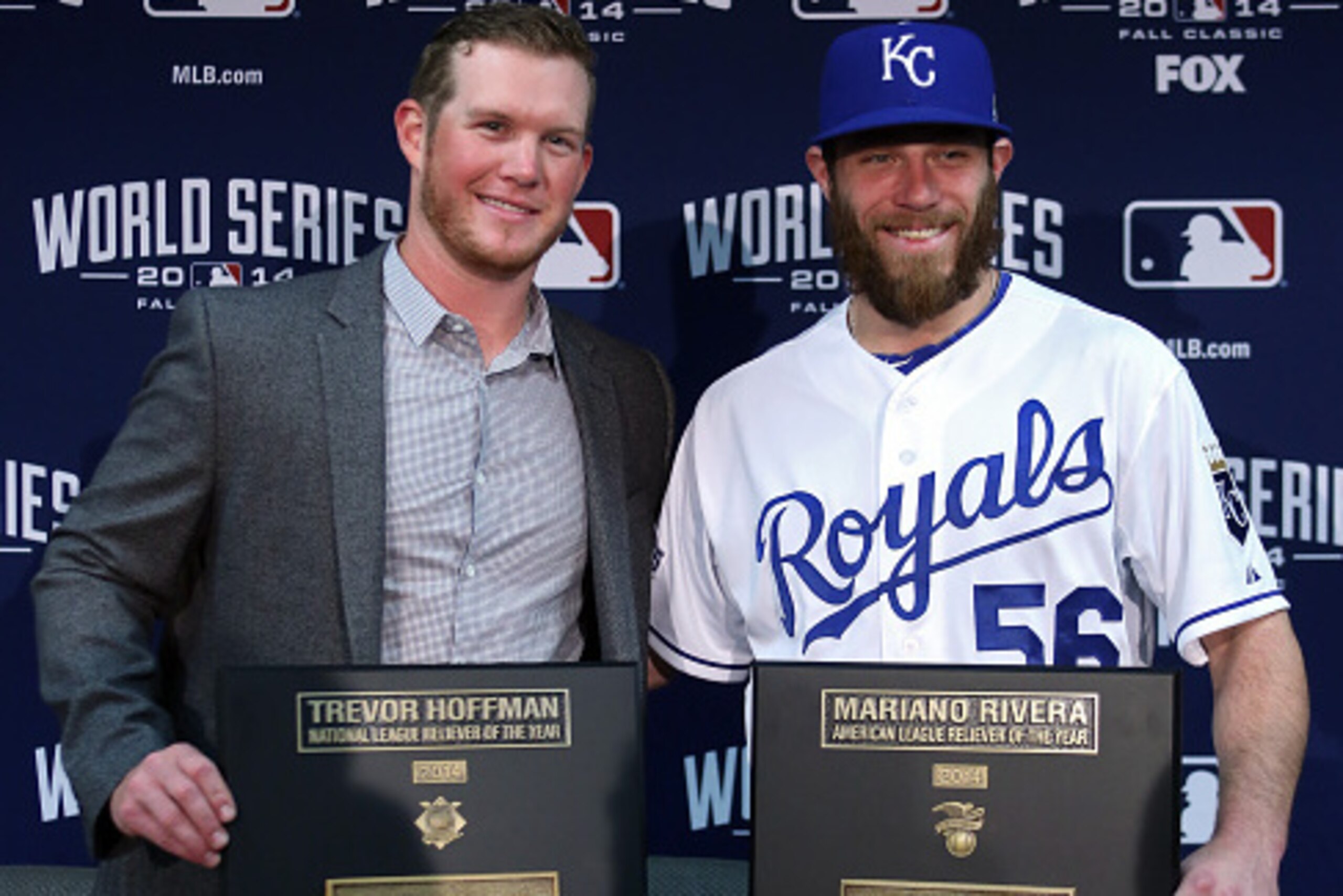 KANSAS CITY, MO - OCTOBER 22: (L-R) Craig Kimbrel of the Atlanta Braves poses after winning the Trevor Hoffman National League Reliever of the Year Award with Greg Holland #56 of the Kansas City Royals after winning the Mariano Rivera American League Reli