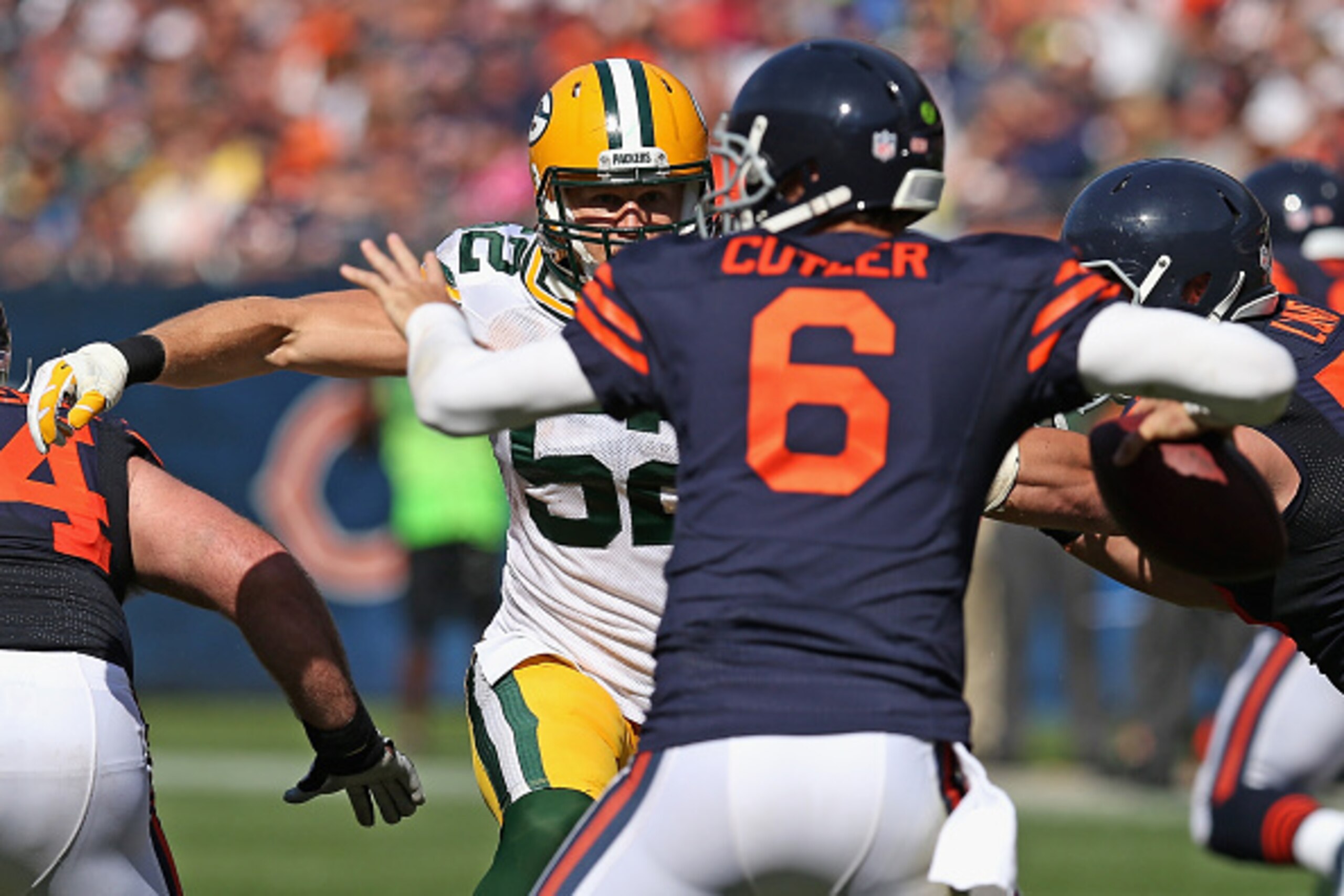 CHICAGO, IL - SEPTEMBER 28:  Clay Matthews #52 of the Green Bay Packers pressures Jay Cutler #6 of the Chicago Bears as he looks to pass during the second half at Soldier Field on September 28, 2014 in Chicago, Illinois.  (Photo by Jonathan Daniel/Getty I