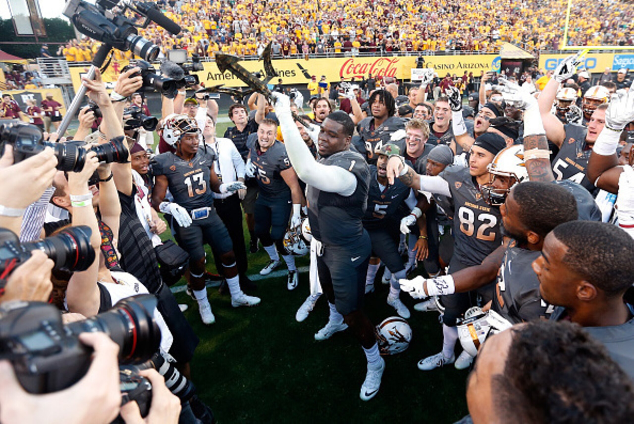 TEMPE, AZ - NOVEMBER 08:  Defensive lineman Marcus Hardison #1 of the Arizona State Sun Devils spikes the pitch fork in celebration after defeating the Notre Dame Fighting Irish 55-31 in the college football game at Sun Devil Stadium on November 8, 2014 i