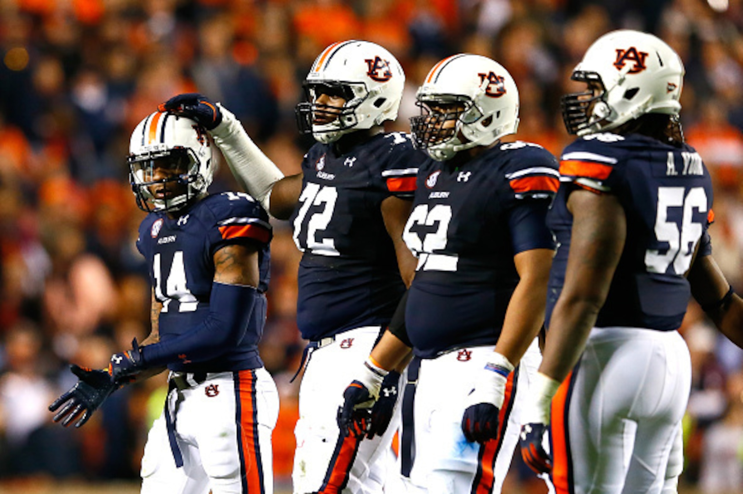 AUBURN, AL - NOVEMBER 08:  Nick Marshall #14 of the Auburn Tigers walks off the field after a fumble turnover to Texas A&M Aggies in the final minutes of their 41-38 loss at Jordan Hare Stadium on November 8, 2014 in Auburn, Alabama.  (Photo by Kevin C. C