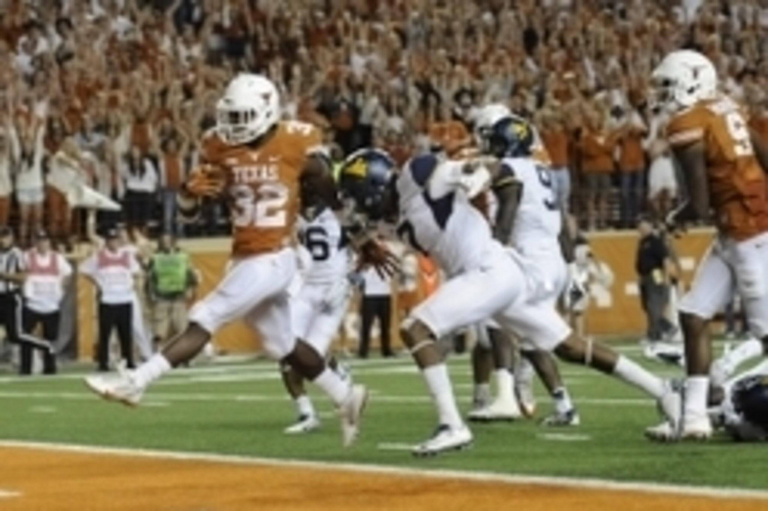 Nov 8, 2014; Austin, TX, USA; Texas Longhorns running back Johnathan Gray (32) runs for a touchdown against the West Virginia Mountaineers during the second half at Darrell K Royal-Texas Memorial Stadium. Texas beat West Virginia 33-16. Mandatory Credit: Nov 8, 2014; Austin, TX, USA; Texas Longhorns running back Johnathan Gray (32) runs for a touchdown against the West Virginia Mountaineers during the second half at Darrell K Royal-Texas Memorial Stadium. Texas beat West Virginia 33-16. Mandatory Credit: