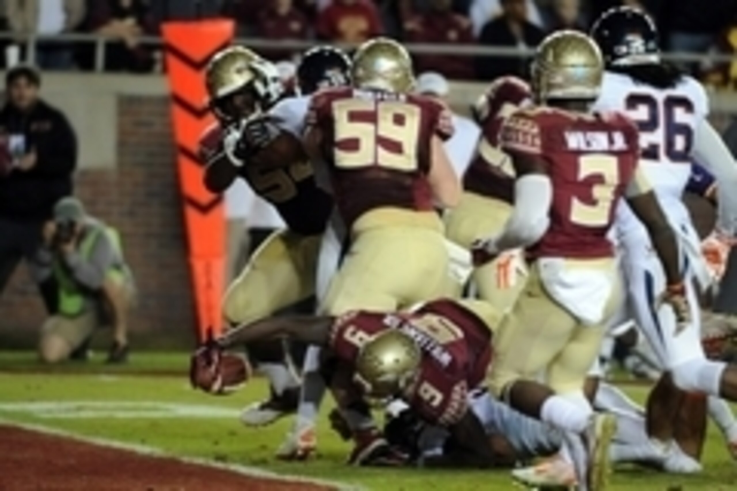 Nov 8, 2014; Tallahassee, FL, USA; Florida State Seminoles running back Karlos Williams (9) dives for a touchdown during the first half of the game against the Virginia Cavaliers at Doak Campbell Stadium. Mandatory Credit: Melina Vastola-USA TODAY Sports