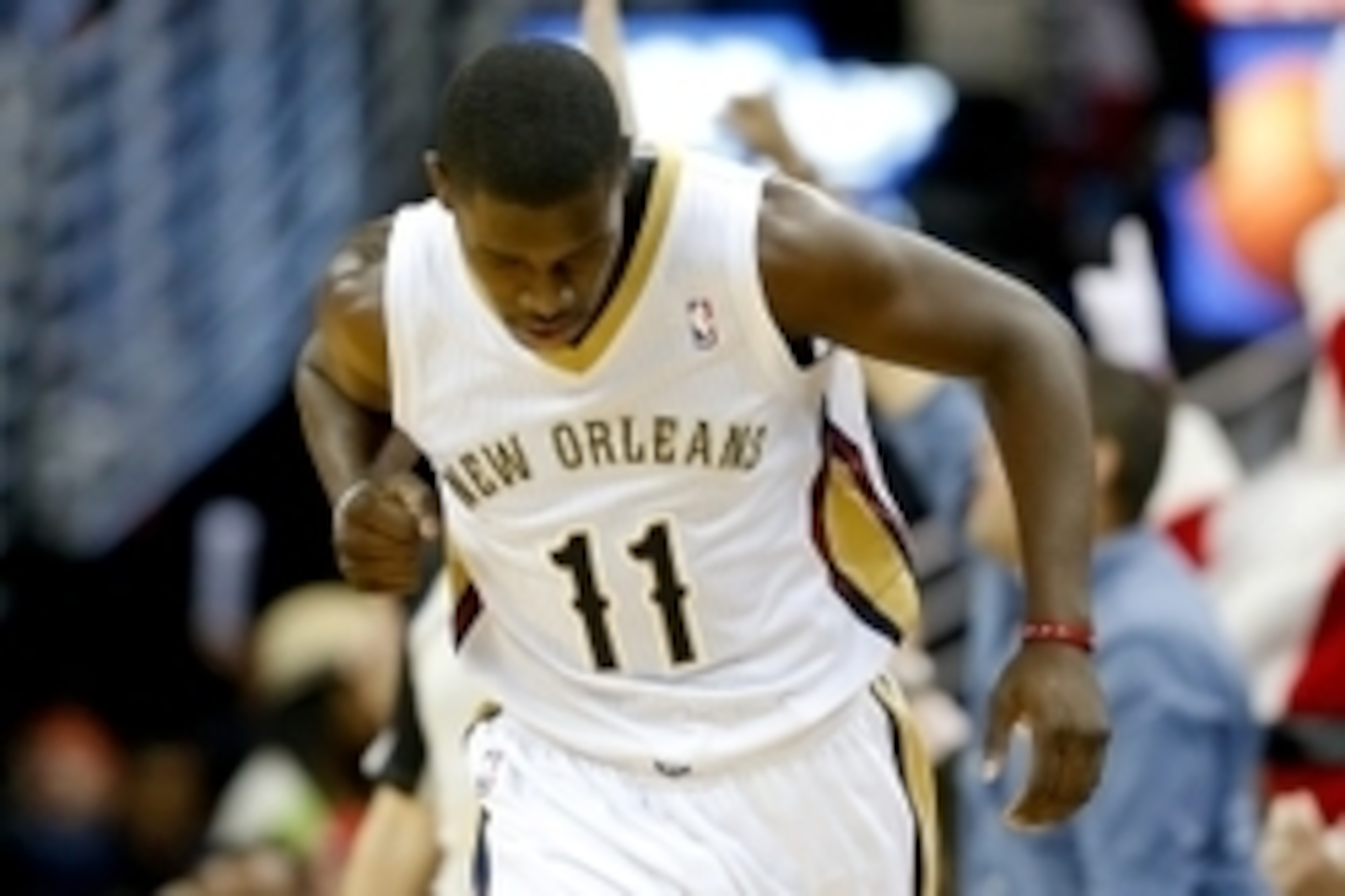 Dec 13, 2013; New Orleans, LA, USA; New Orleans Pelicans point guard Jrue Holiday (11) reacts after scoring  against the Memphis Grizzlies during the fourth quarter at New Orleans Arena. The Pelicans won 104-98. Mandatory Credit: Derick E. Hingle-USA TODA