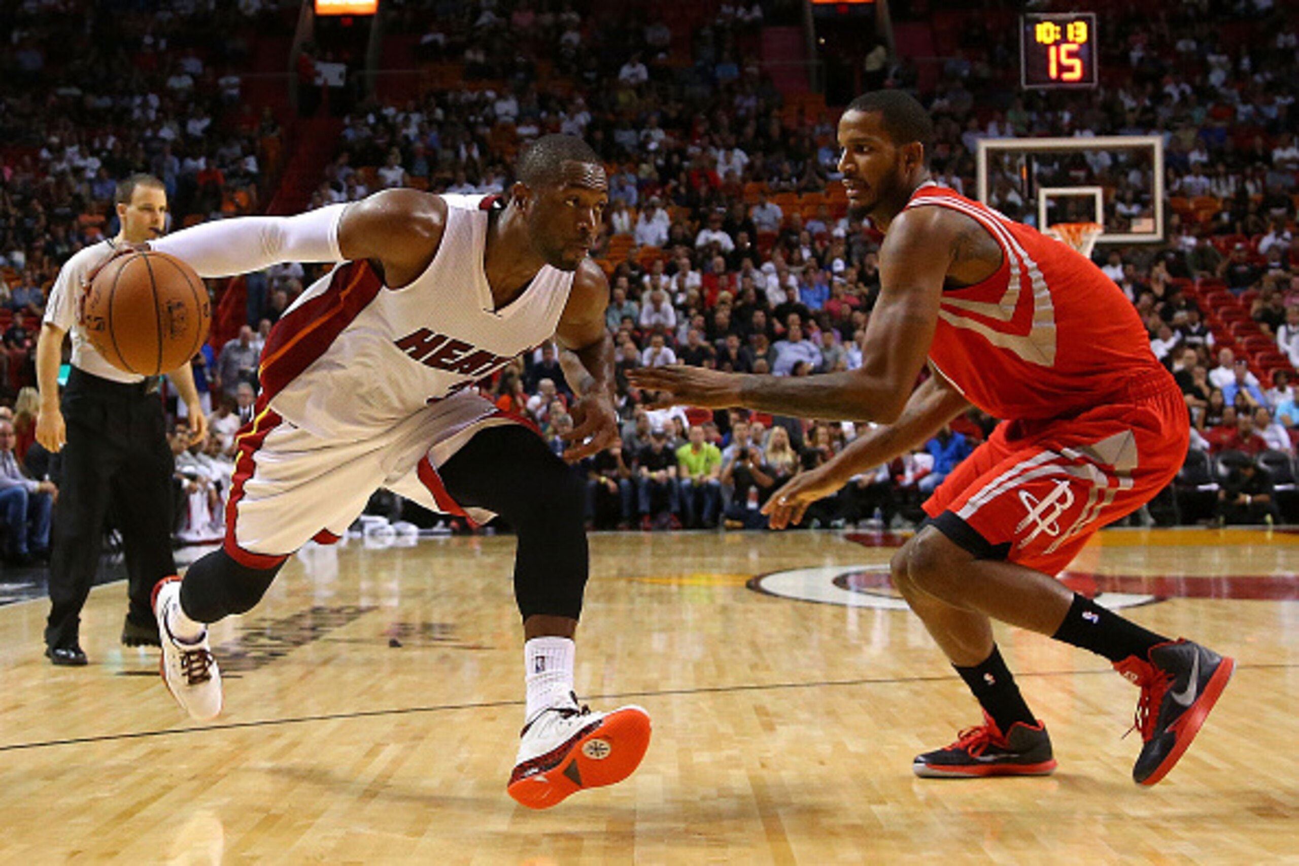 MIAMI, FL - NOVEMBER 04: Dwyane Wade #3 of the Miami Heat drives on Trevor Ariza #1 of the Houston Rockets during a game  at American Airlines Arena on November 4, 2014 in Miami, Florida. NOTE TO USER: User expressly acknowledges and agrees that, by downl