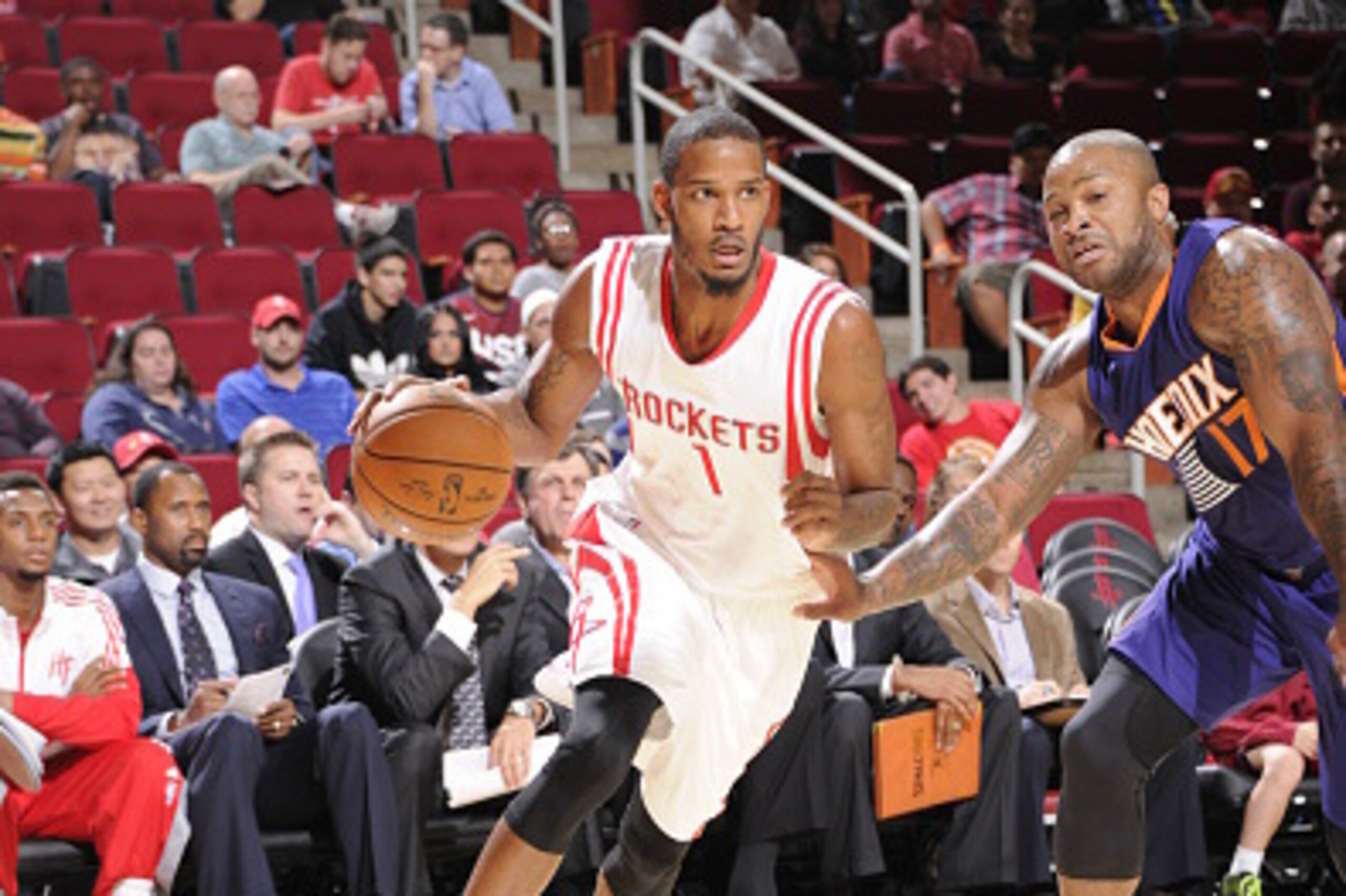 HOUSTON, TX - OCTOBER 13: Trevor Ariza #1 of the Houston Rockets handles the ball against the Phoenix Suns on October 13, 2014 at the Toyota Center in Houston, Texas. NOTE TO USER: User expressly acknowledges and agrees that, by downloading and or using t