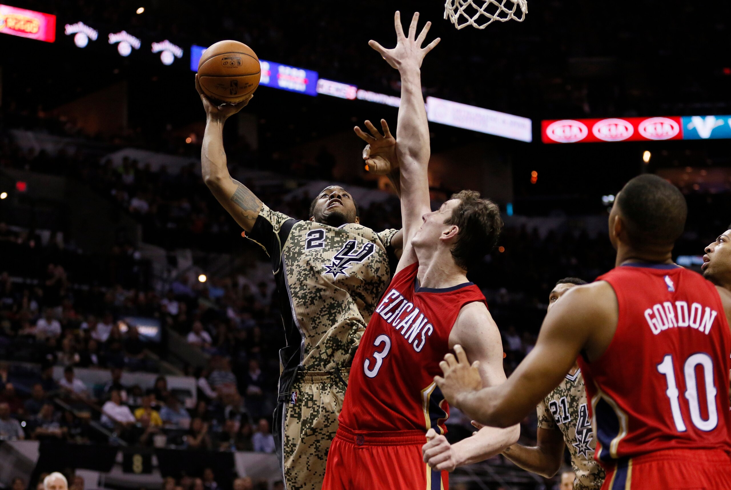 Nov 8, 2014; San Antonio, TX, USA; San Antonio Spurs small forward Kawhi Leonard (2) shoots the ball against  New Orleans Pelicans center Omer Asik (3) during the second half at AT&T Center. Mandatory Credit: Soobum Im-USA TODAY Sports