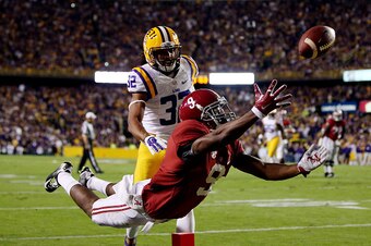 BATON ROUGE, LA - NOVEMBER 08: Amari Cooper #9 of the Alabama Crimson Tide fails to make a catch in the second quarter as Jalen Collins #32 of the LSU Tigers defends during a game at Tiger Stadium on November 8, 2014 in Baton Rouge, Louisiana.  (Photo by 