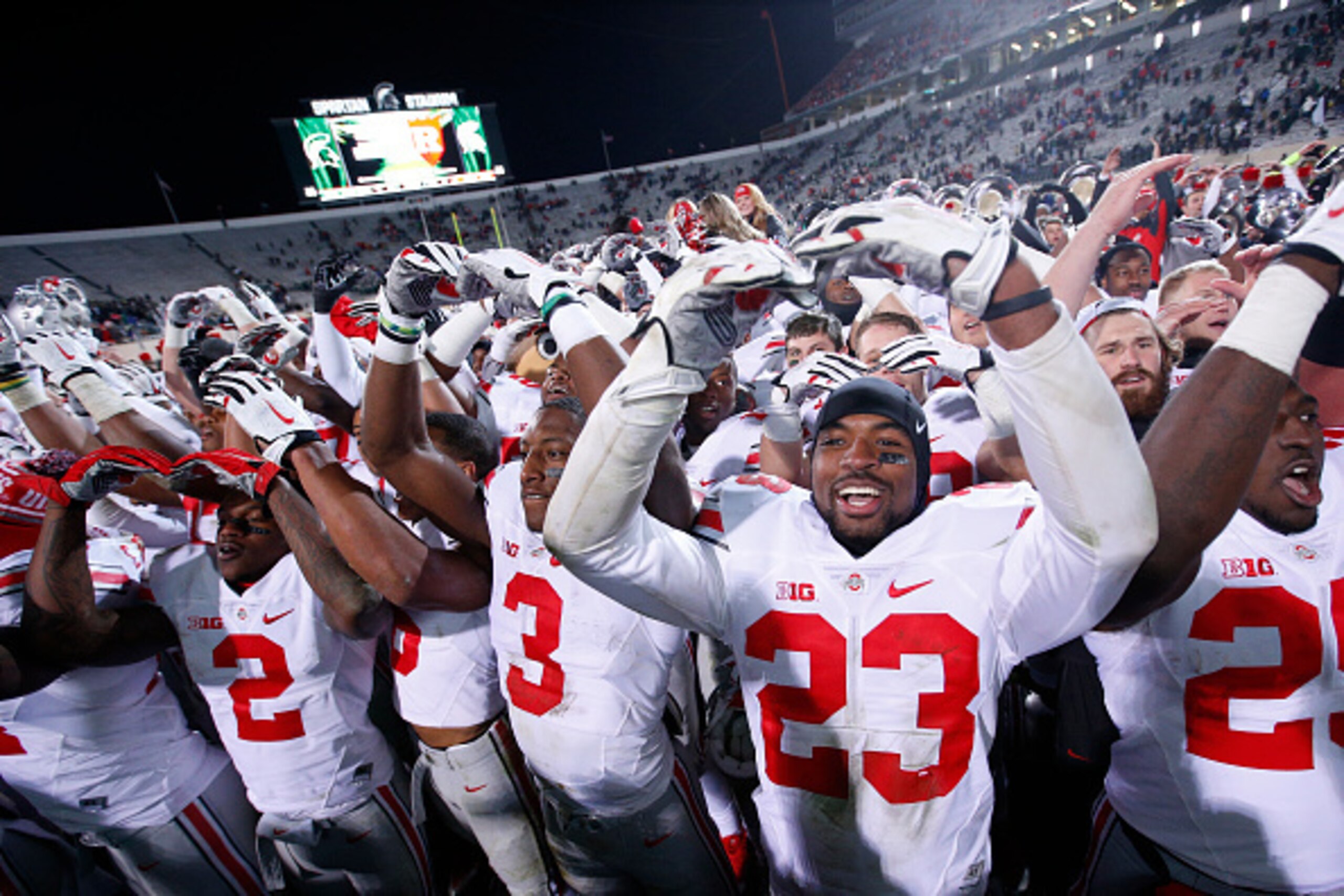 EAST LANSING, MI - NOVEMBER 8: Ohio State Buckeyes players celebrate after a 49-37 win over the Michigan State Spartans at Spartan Stadium on November 8, 2014 in East Lansing, Michigan. (Photo by Joe Robbins/Getty Images)