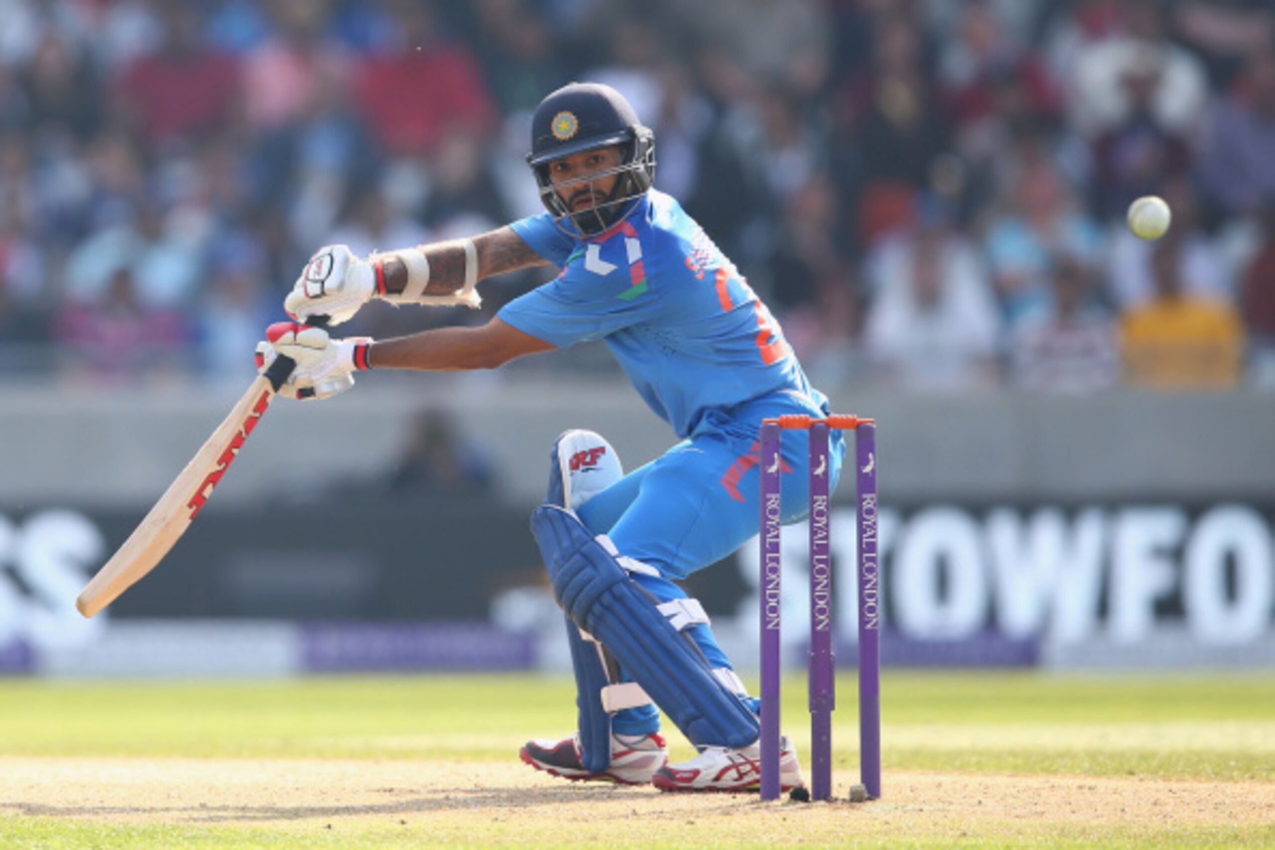 BIRMINGHAM, ENGLAND - SEPTEMBER 02:  Shikhar Dhawan of India plays to the offside during the fourth Royal London One-Day Series match between England and India at  Edgbaston on September 2, 2014 in Birmingham, England.  (Photo by Michael Steele/Getty Imag
