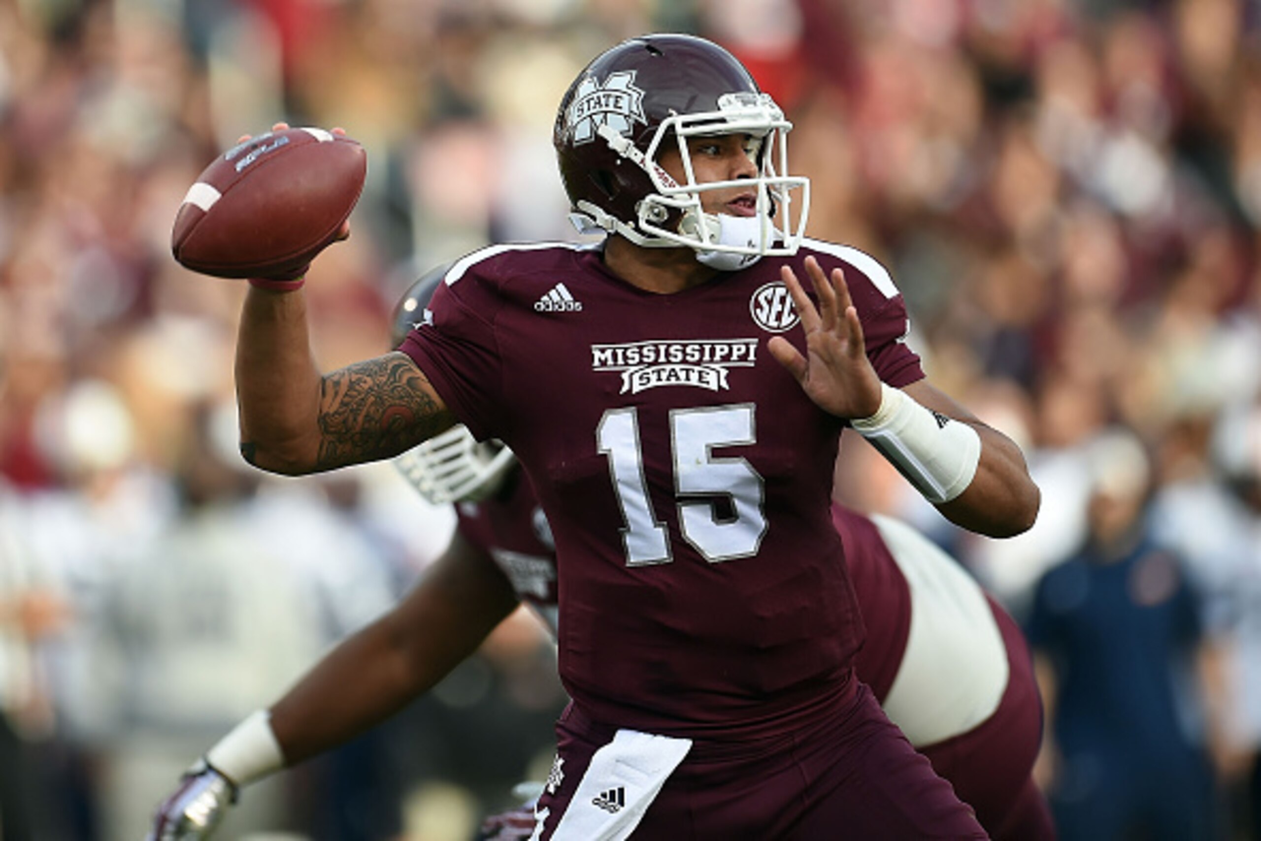 STARKVILLE, MS - NOVEMBER 08:  Dak Prescott #15 of the Mississippi State Bulldogs drops back to pass against the Tennessee Martin Skyhawks during the first quarter of a game at Davis Wade Stadium on November 8, 2014 in Starkville, Mississippi.  (Photo by 