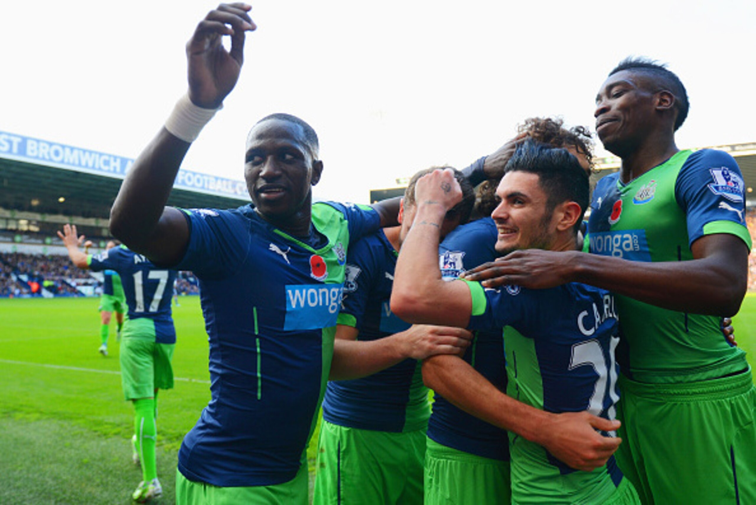 WEST BROMWICH, ENGLAND - NOVEMBER 09:  Fabricio Coloccini of Newcastle United (obscured 3R) celebrates with team mates as he scores their second goal during the Barclays Premier League match between West Bromwich Albion and Newcastle United at The Hawthor