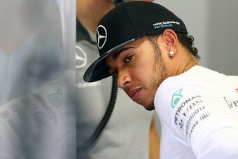 SAO PAULO, BRAZIL - NOVEMBER 09:  Lewis Hamilton of Great Britain and Mercedes GP prepares in the garage before the Brazilian Formula One Grand Prix at Autodromo Jose Carlos Pace on November 9, 2014 in Sao Paulo, Brazil.  (Photo by Clive Mason/Getty Image