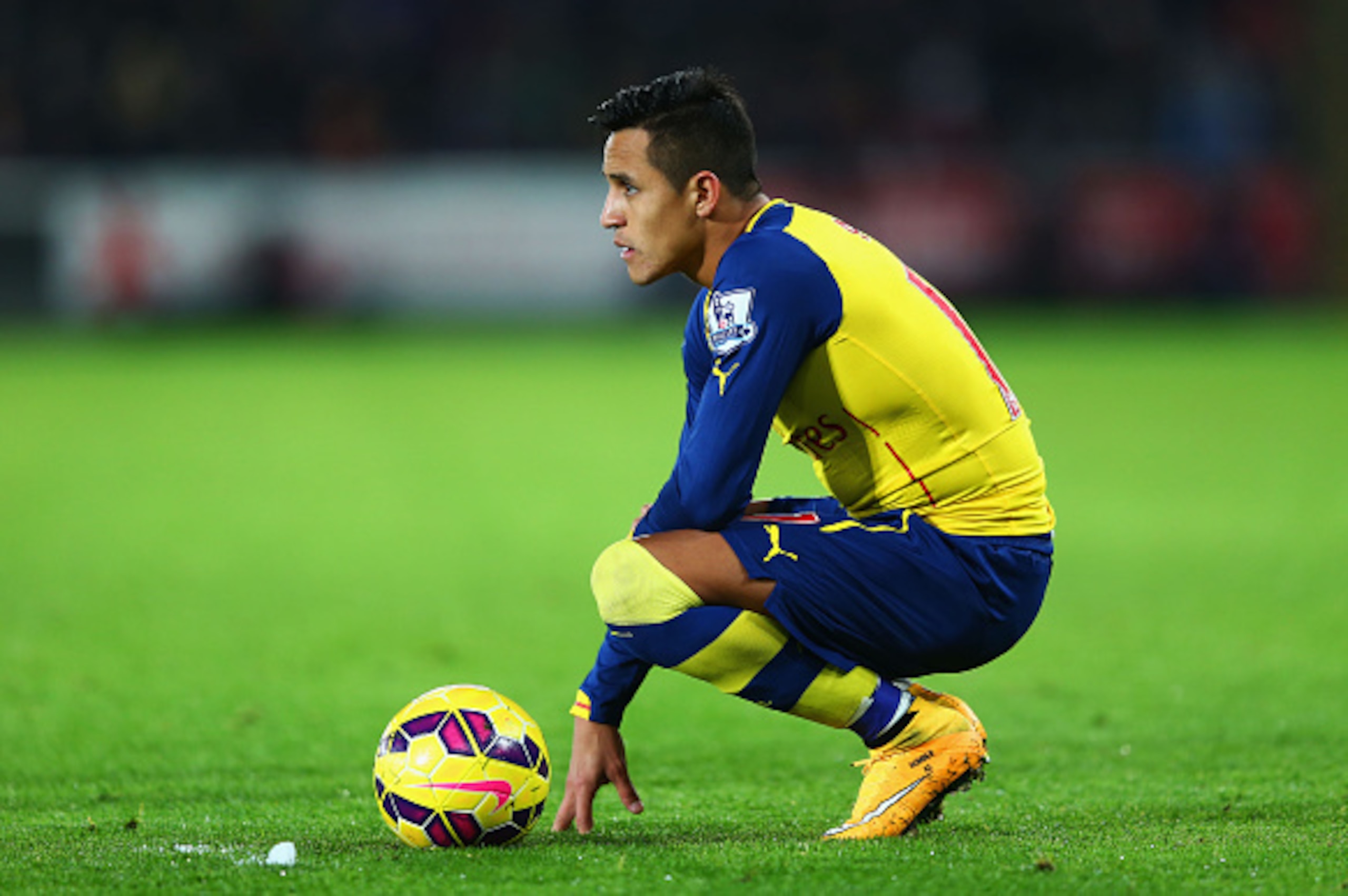SWANSEA, WALES - NOVEMBER 09:  Alexis Sanchez of Arsenal looks on during the Barclays Premier League match between Swansea City and Arsenal at Liberty Stadium on November 9, 2014 in Swansea, Wales.  (Photo by Michael Steele/Getty Images)
