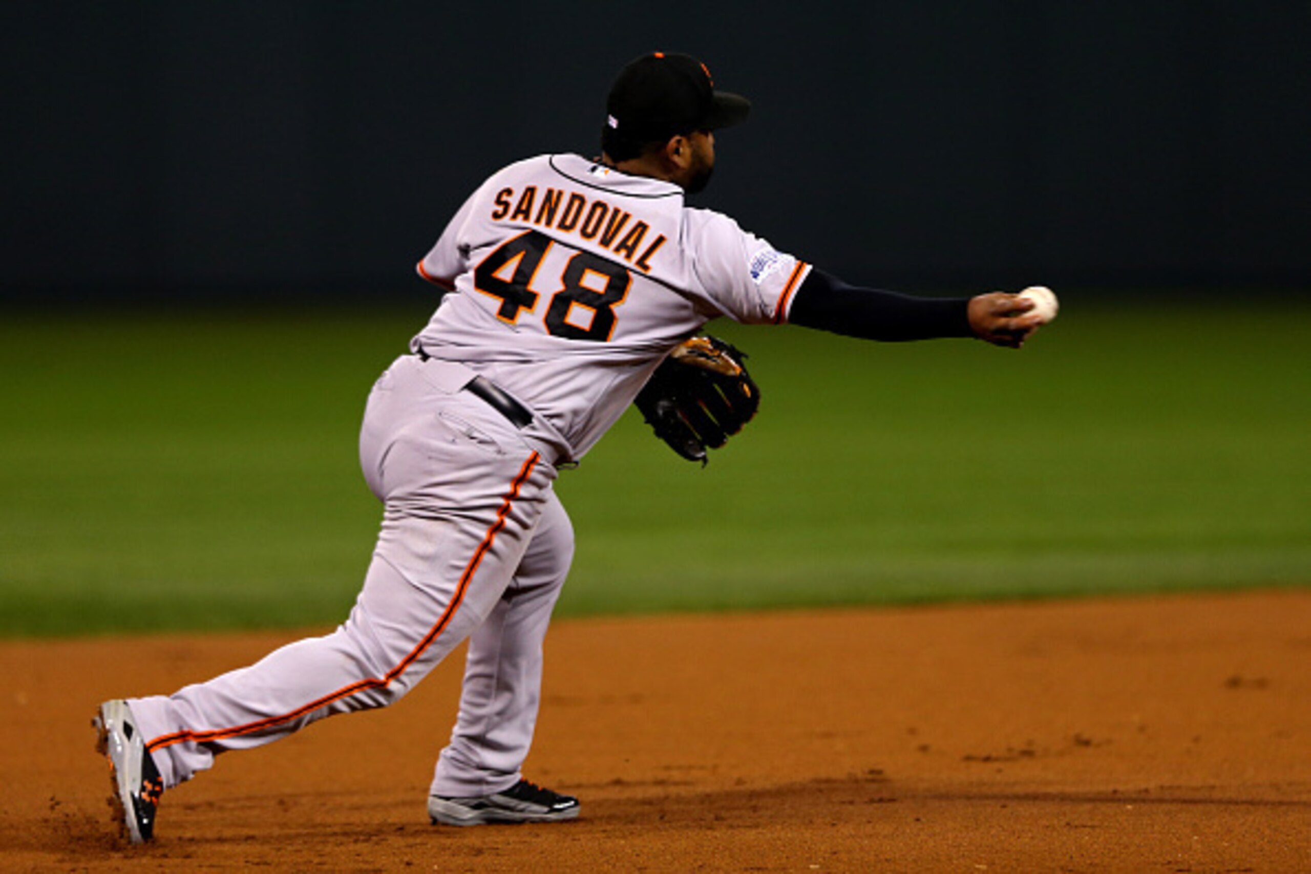 KANSAS CITY, MO - OCTOBER 29: Pablo Sandoval #48 of the San Francisco Giants makes a throw to second base in the first inning against the Kansas City Royals during Game Seven of the 2014 World Series at Kauffman Stadium on October 29, 2014 in Kansas City,