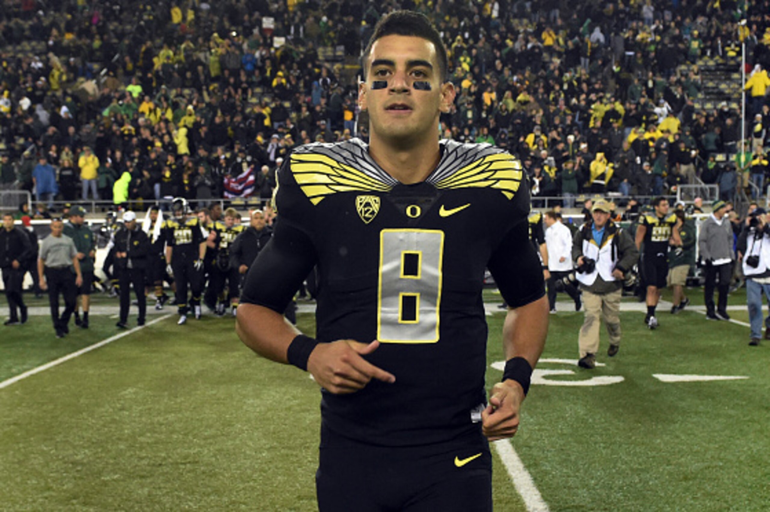 EUGENE, OR - NOVEMBER 1: Quarterback Marcus Mariota #8 of the Oregon Ducks runs out onto the field after the game against the Stanford Cardinal at Autzen Stadium on November 1, 2014 in Eugene, Oregon. Oregon won the game 45-16.(Photo by Steve Dykes/Getty 