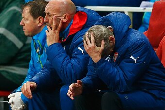 LONDON, ENGLAND - NOVEMBER 04:  Arsene Wenger, manager of Arsenal reacts on the bench as a 3-0 lead is lost during the UEFA Champions League Group D match between Arsenal FC and RSC Anderlecht at Emirates Stadium on November 4, 2014 in London, United King