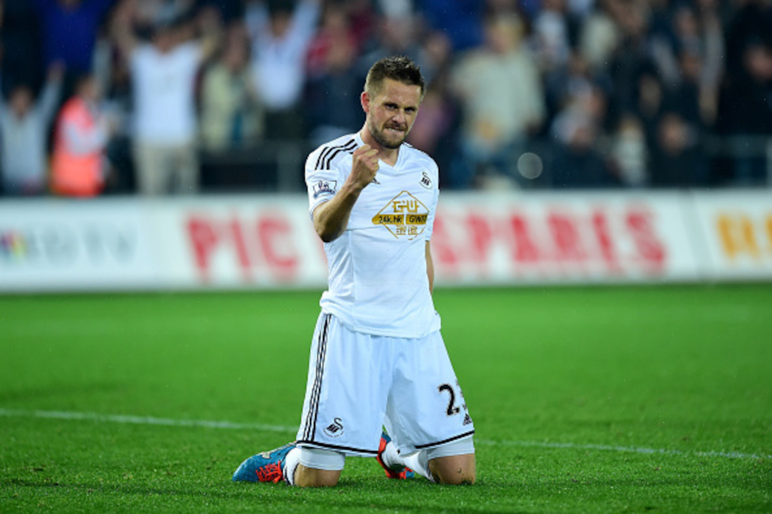 SWANSEA, WALES - SEPTEMBER 23:  Swansea player Gylfi Sigurdsson celebrates after scoring the second Swansea goal during the Capital One Cup Third Round match between Swansea City and Everton at Liberty Stadium on September 23, 2014 in Swansea, Wales.  (Ph