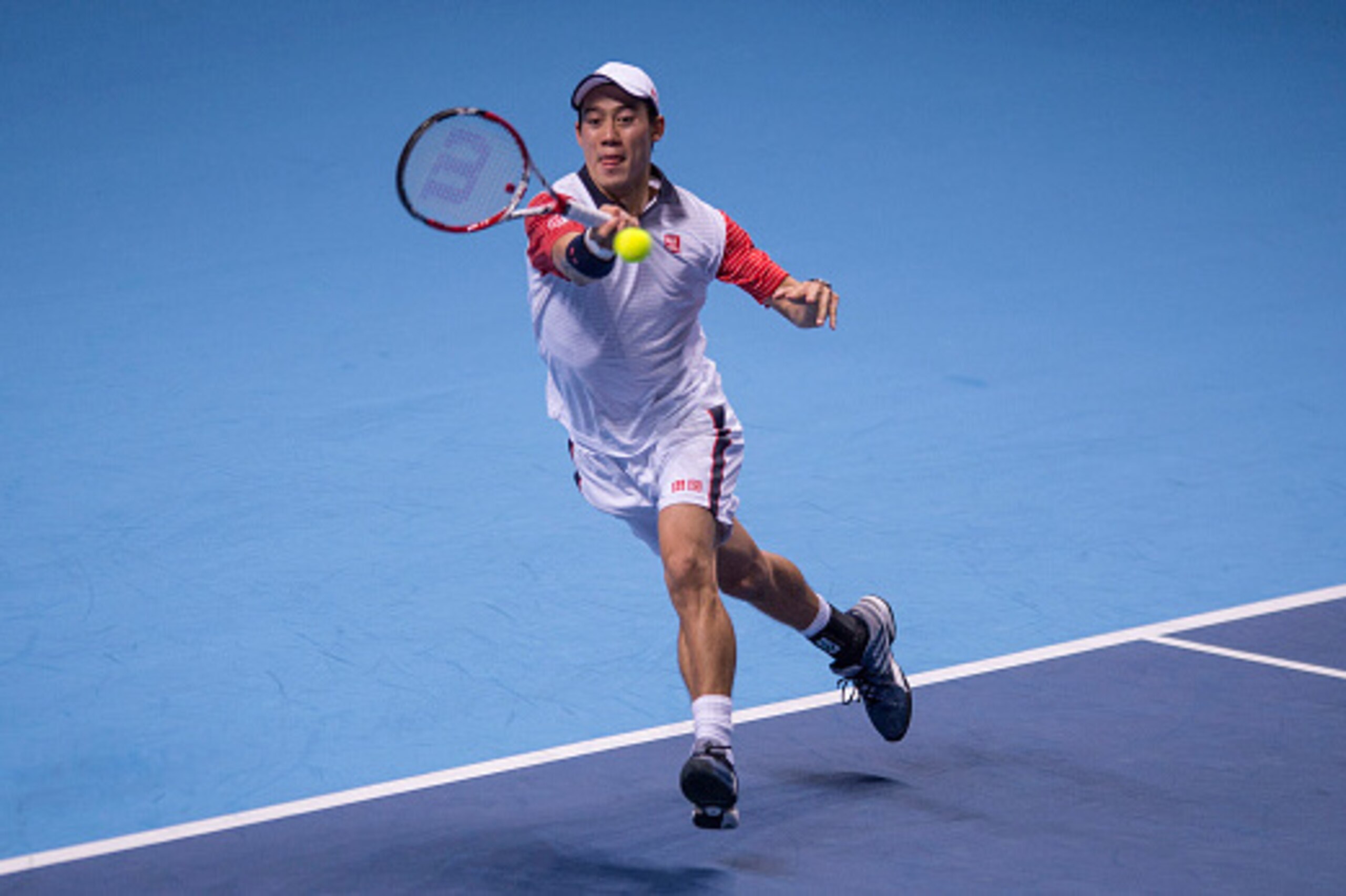 LONDON, ENGLAND - NOVEMBER 09: Kei Nishikori of Japan in action in his match against Andy Murray of Great Britain in the round robin during day one of the Barclays ATP World Tour Finals tennis at O2 Arena on November 9, 2014 in London, England. (Photo b LONDON, ENGLAND - NOVEMBER 09: Kei Nishikori of Japan in action in his match against Andy Murray of Great Britain in the round robin during day one of the Barclays ATP World Tour Finals tennis at O2 Arena on November 9, 2014 in London, England. (Photo b
