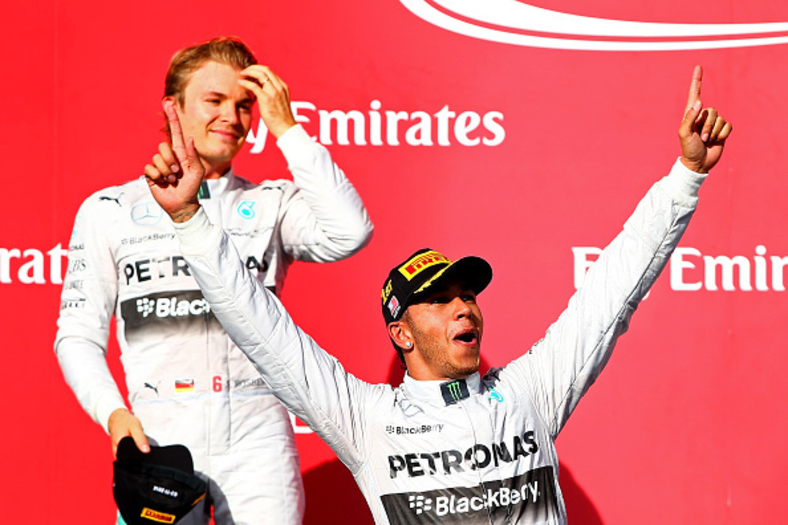 AUSTIN, TX - NOVEMBER 02: Lewis Hamilton of Great Britain and Mercedes GP celebrates on the podium next to Nico Rosberg of Germany and Mercedes GP following his victory in the United States Formula One Grand Prix at Circuit of The Americas on November 2, AUSTIN, TX - NOVEMBER 02: Lewis Hamilton of Great Britain and Mercedes GP celebrates on the podium next to Nico Rosberg of Germany and Mercedes GP following his victory in the United States Formula One Grand Prix at Circuit of The Americas on November 2,