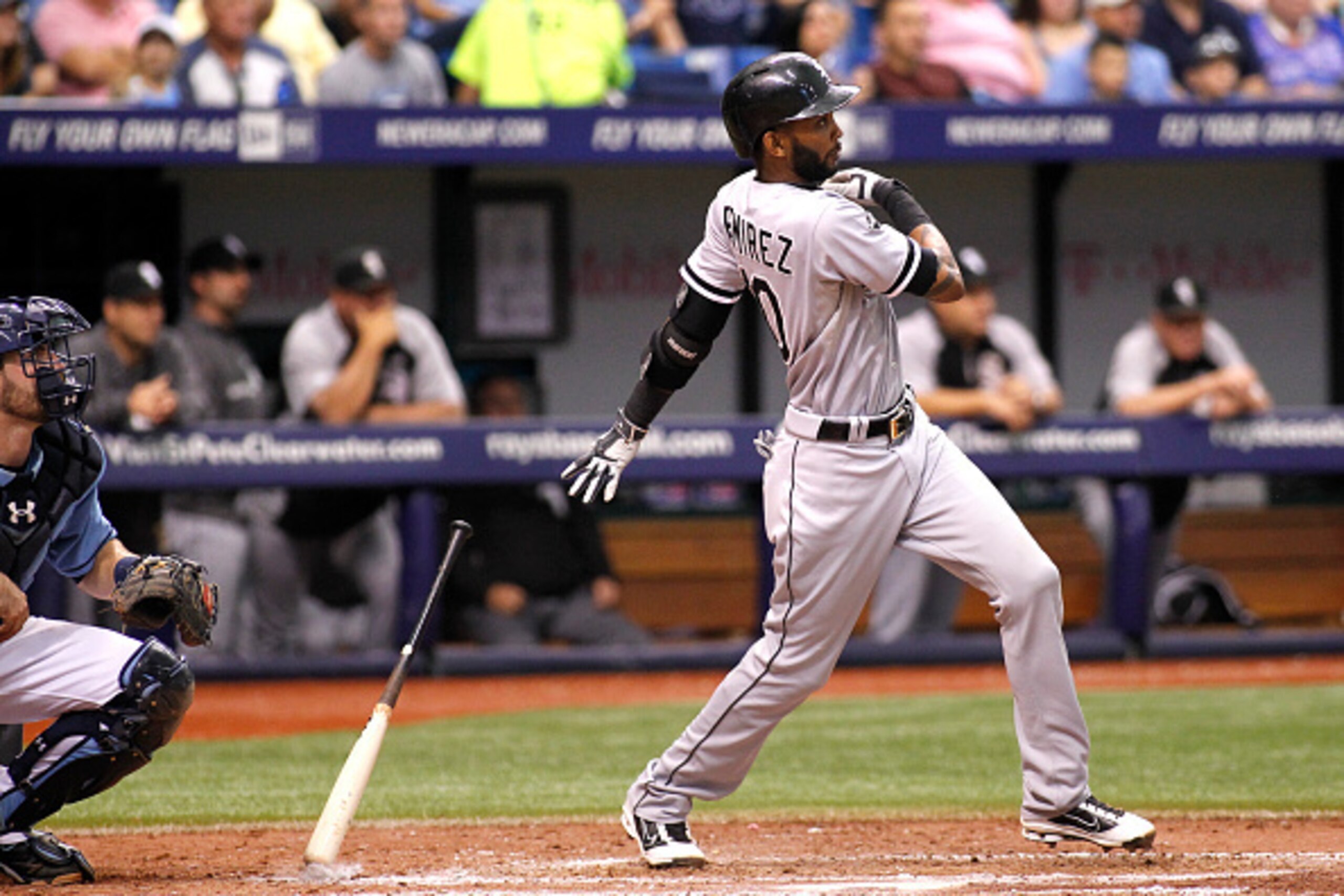 ST. PETERSBURG, FL - SEPTEMBER 21:  Alexei Ramirez #10 of the Chicago White Sox hits a two-run double in front of catcher Curt Casali #59 of the Tampa Bay Rays during the sixth inning of a game on September 21, 2014 at Tropicana Field in St. Petersburg, F