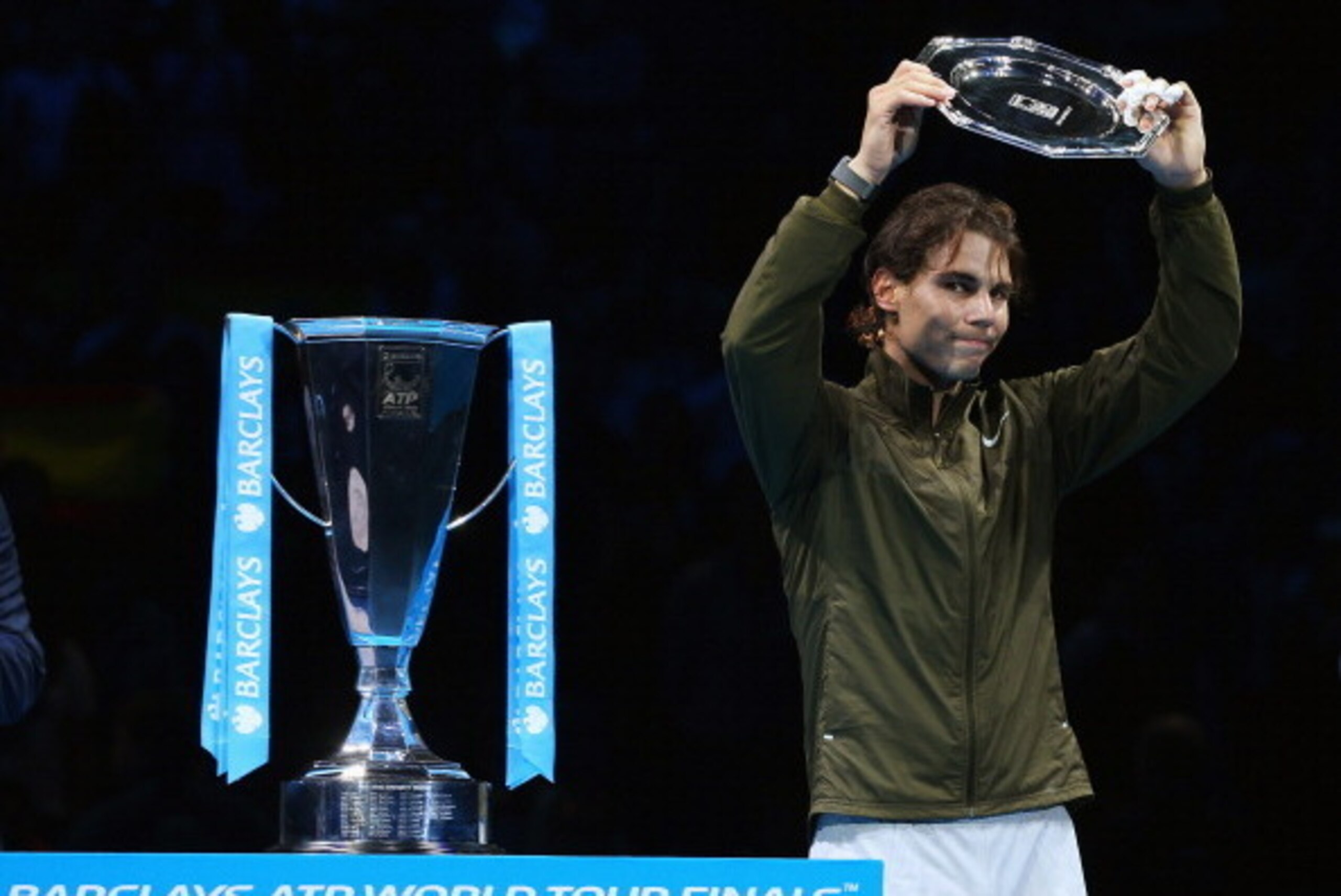 LONDON, ENGLAND - NOVEMBER 11:  Rafael Nadal of Spain collects his runners up trophy after defeat in his men's singles final match against Novak Djokovic of Serbia during day eight of the Barclays ATP World Tour Finals at O2 Arena on November 11, 2013 in 