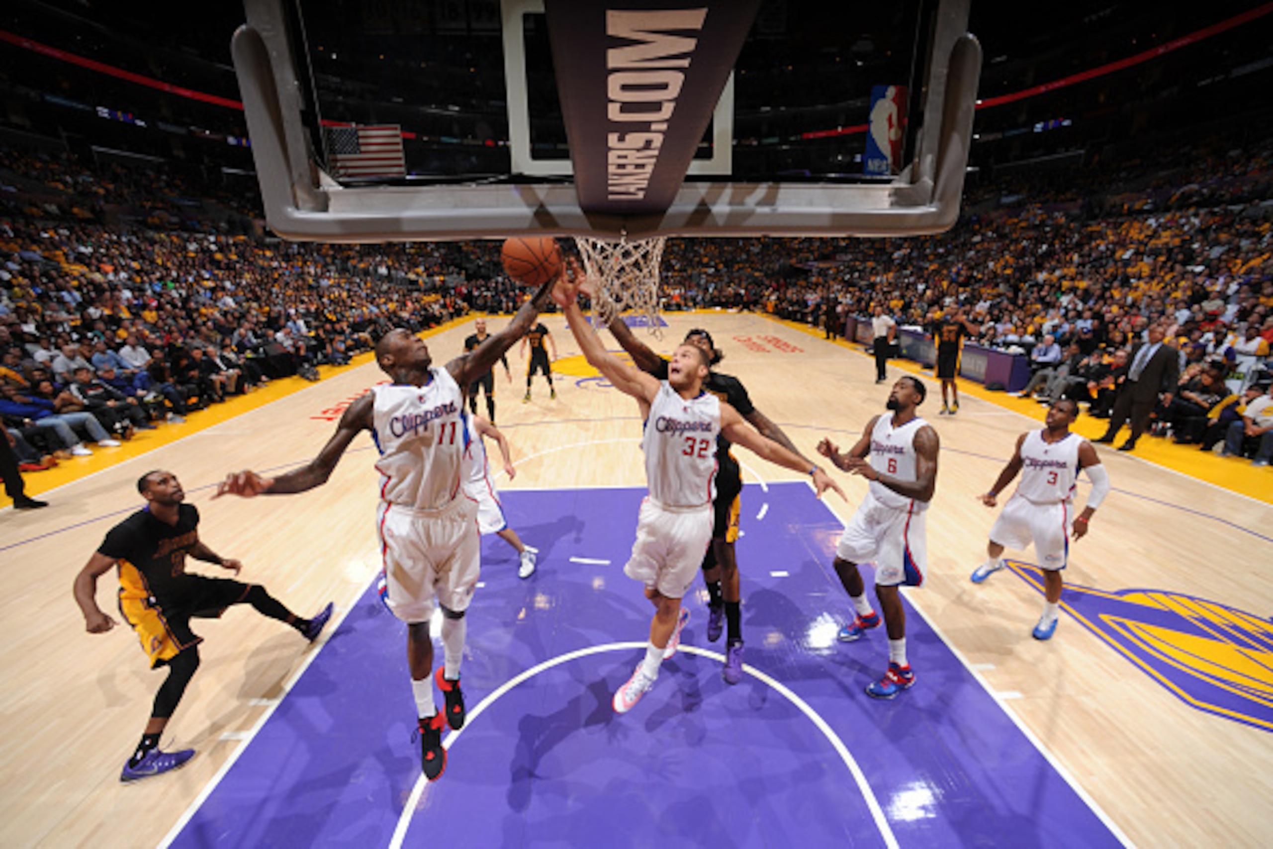 LOS ANGELES, CA - OCTOBER 31: Jamal Crawford #11 and Blake Griffin #32 of the Los Angeles Clippers rebounds against the Los Angeles Lakers at STAPLES Center on October 31, 2014 in Los Angeles, California. NOTE TO USER: User expressly acknowledges and agre