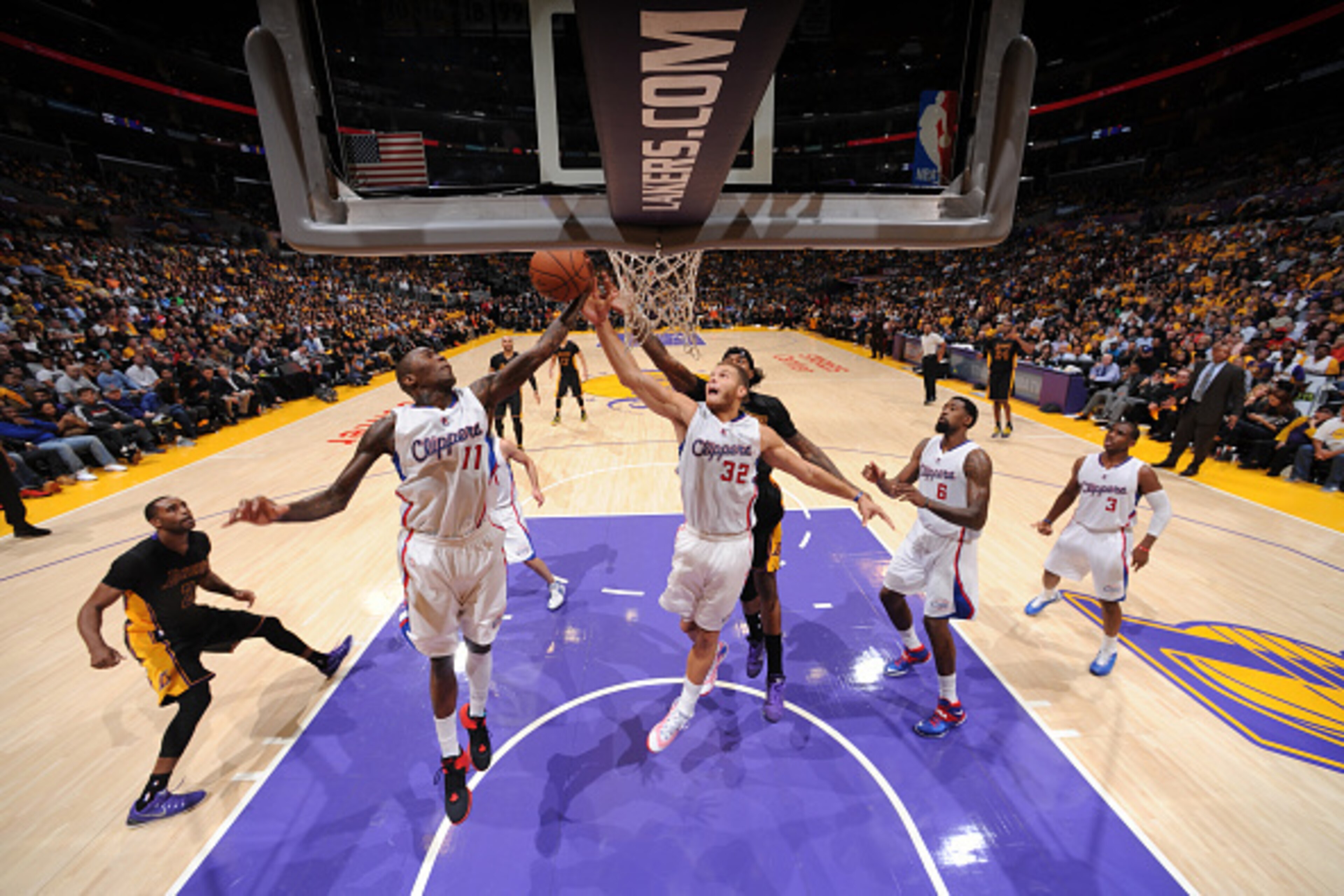 LOS ANGELES, CA - OCTOBER 31: Jamal Crawford #11 and Blake Griffin #32 of the Los Angeles Clippers rebounds against the Los Angeles Lakers at STAPLES Center on October 31, 2014 in Los Angeles, California. NOTE TO USER: User expressly acknowledges and agre