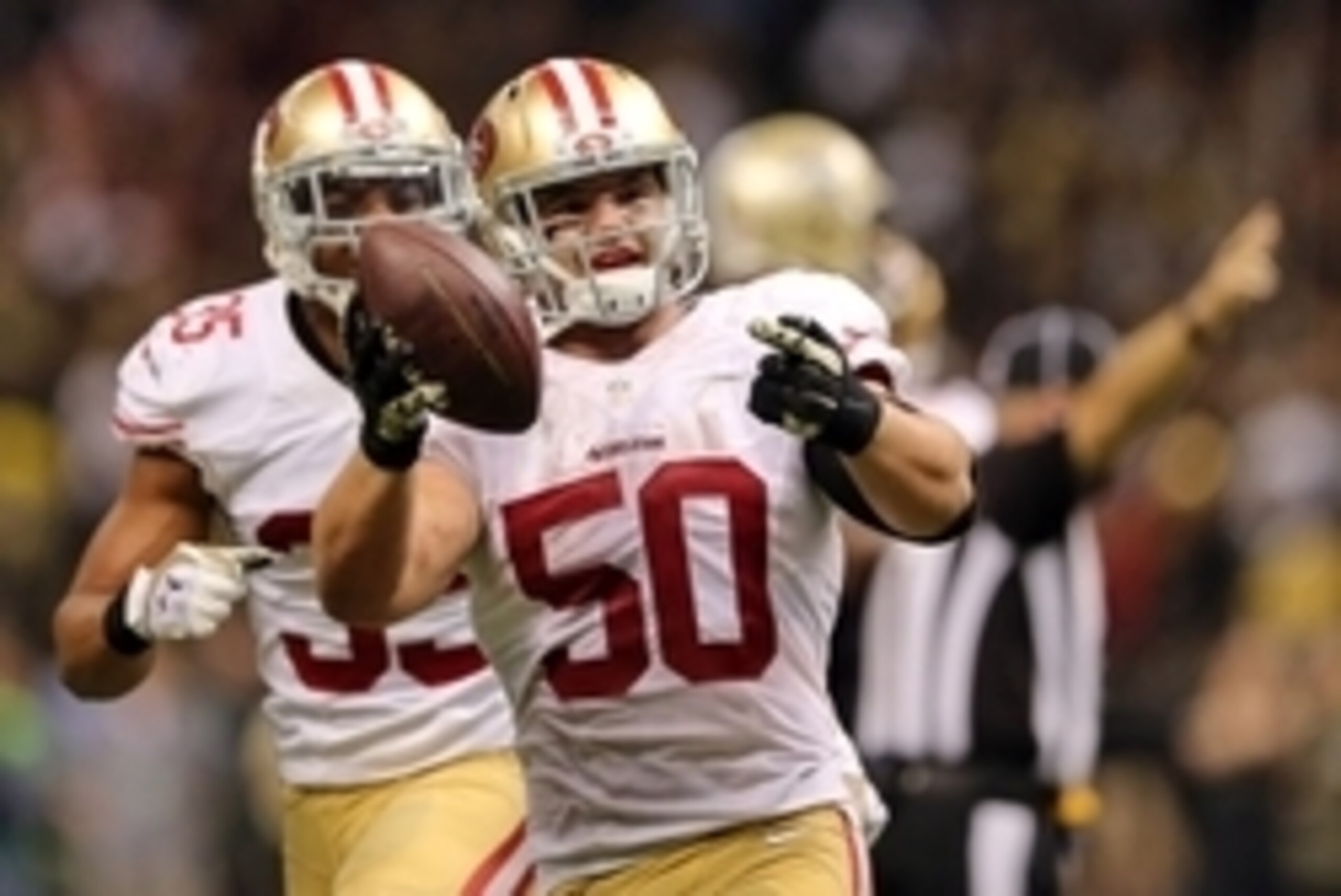 Nov 9, 2014; New Orleans, LA, USA; San Francisco 49ers inside linebacker Chris Borland (50) celebrates after a fumbled by New Orleans Saints quarterback Drew Brees (not pictured) in overtime at Mercedes-Benz Superdome. The 49ers won 27-24. Mandatory Credi