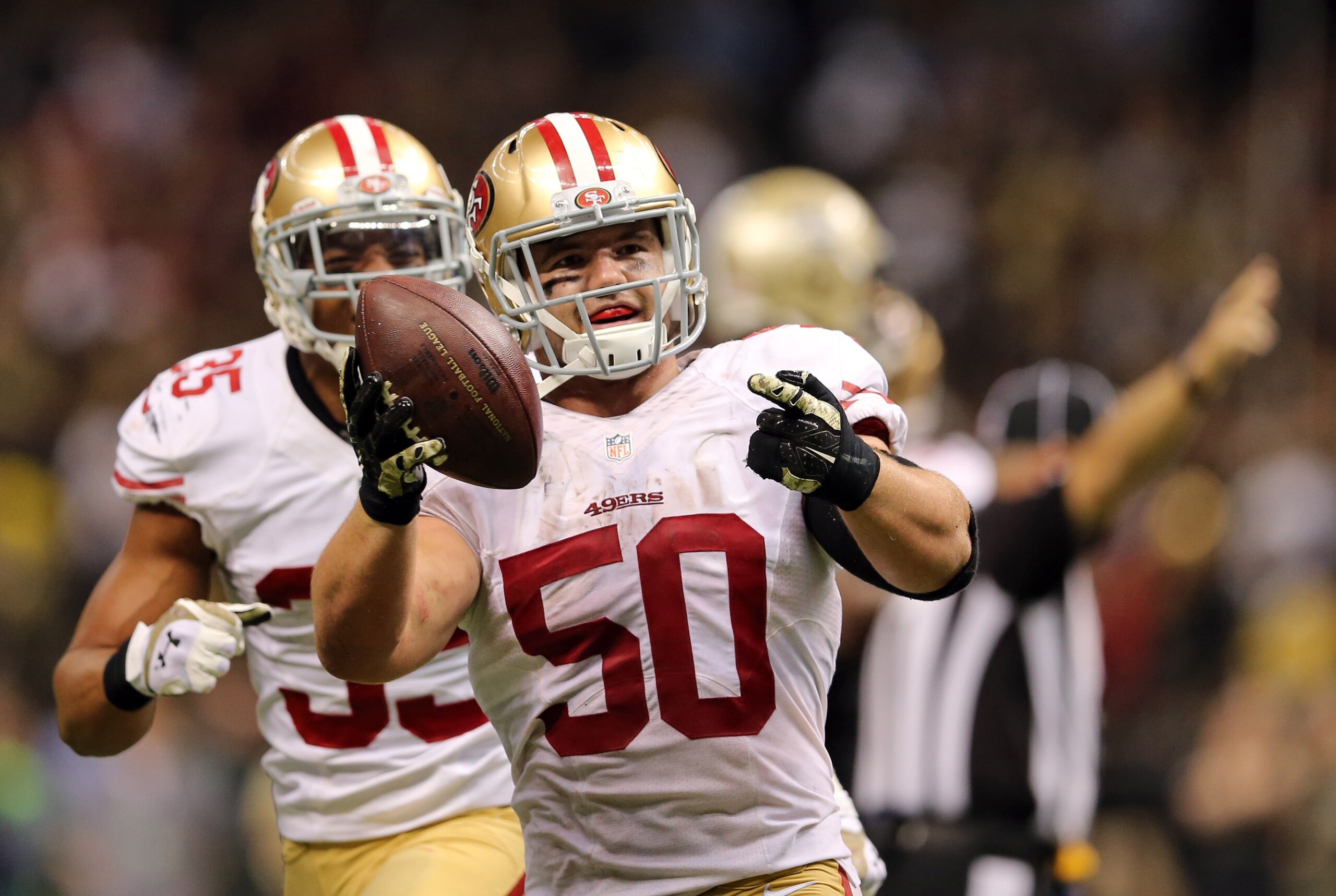 Nov 9, 2014; New Orleans, LA, USA; San Francisco 49ers inside linebacker Chris Borland (50) celebrates after a fumbled by New Orleans Saints quarterback Drew Brees (not pictured) in overtime at Mercedes-Benz Superdome. The 49ers won 27-24. Mandatory Credi